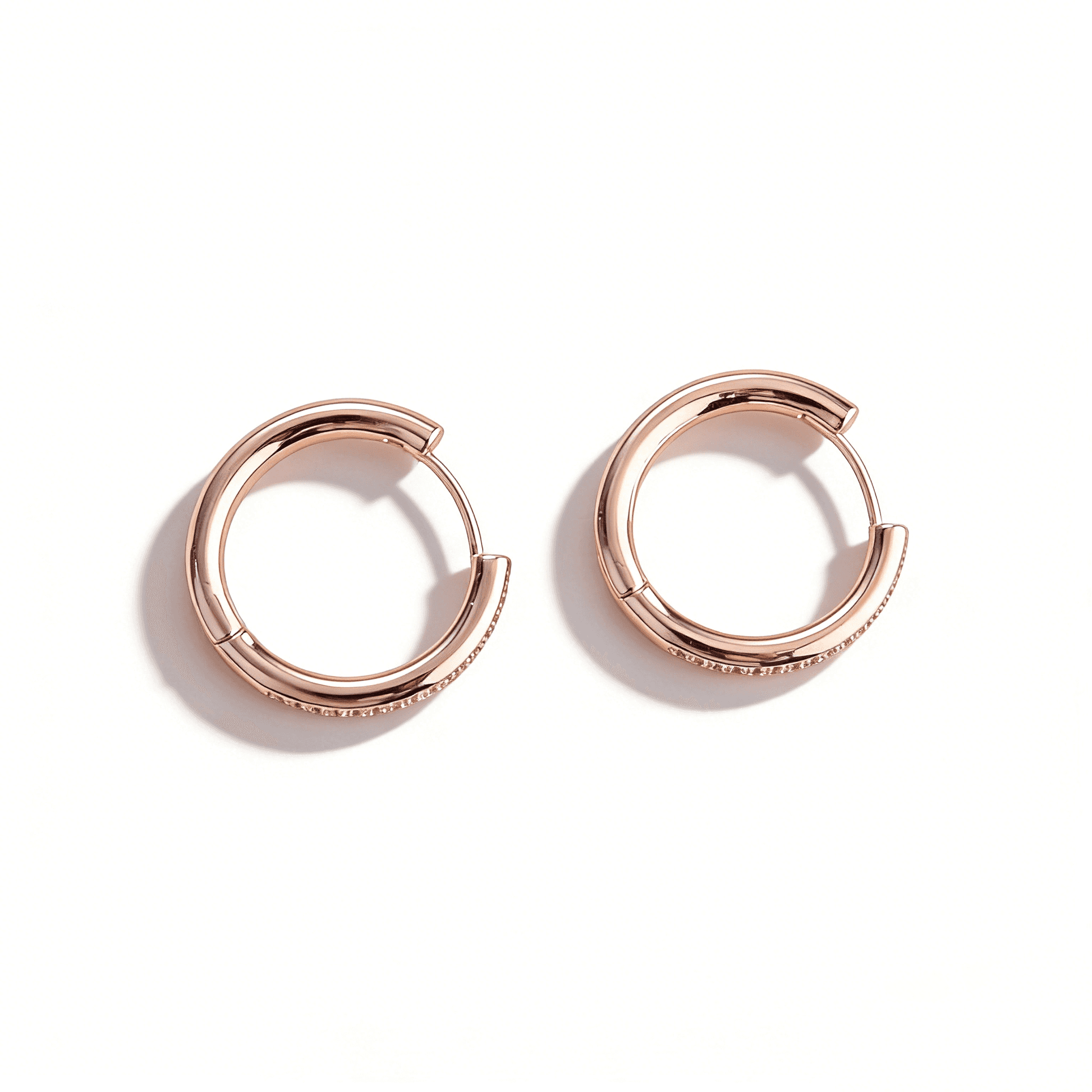 Front view of Ever P. rose gold hoop earrings featuring a full eternity pave setting of cubic zirconia.