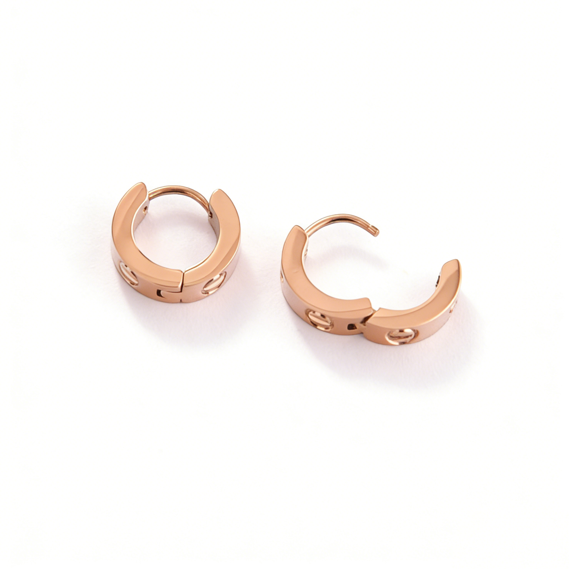 A pair of hypoallergenic rose gold earrings by Ever P., designed as durable and waterproof gold jewelry for her.
