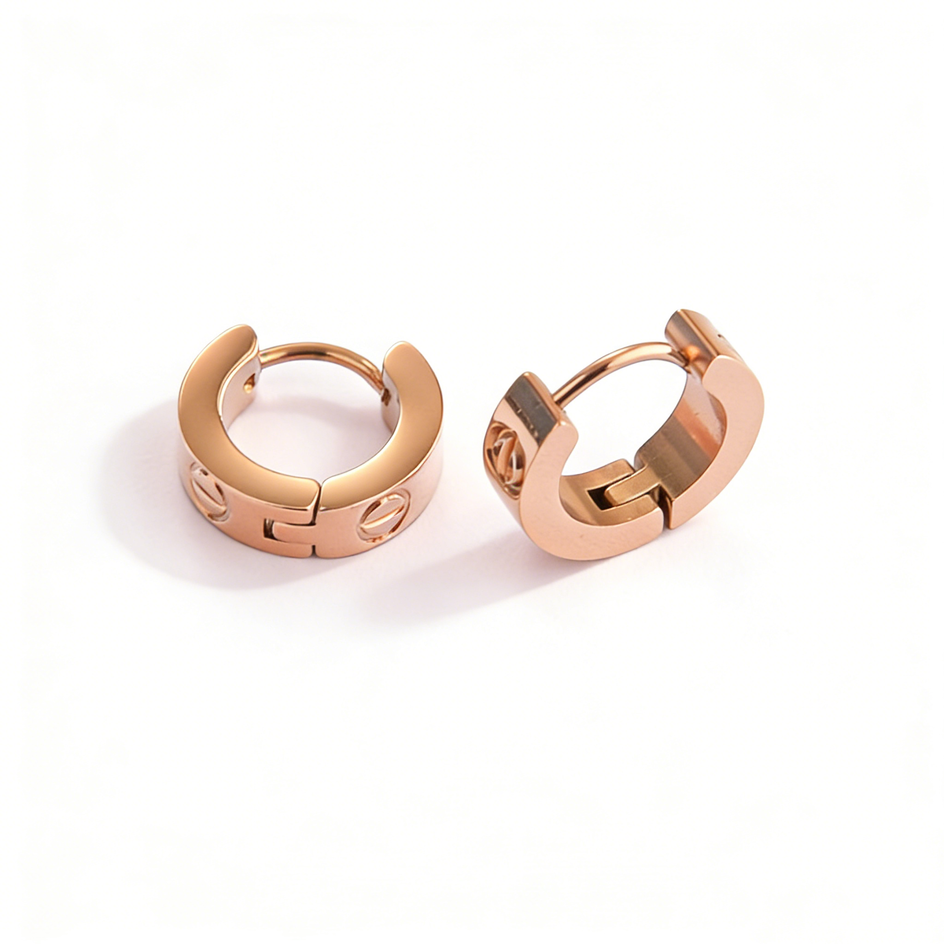 Side profile of dainty rose gold hoops, showcasing a high-polish minimalist style and secure closure.