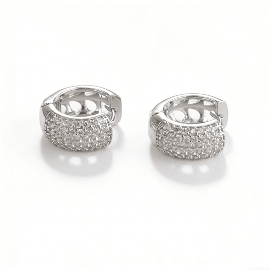 Front view of Ever P. small silver huggie hoop earrings, highlighting the brilliant micro-pave cubic zirconia setting against a clean white background.