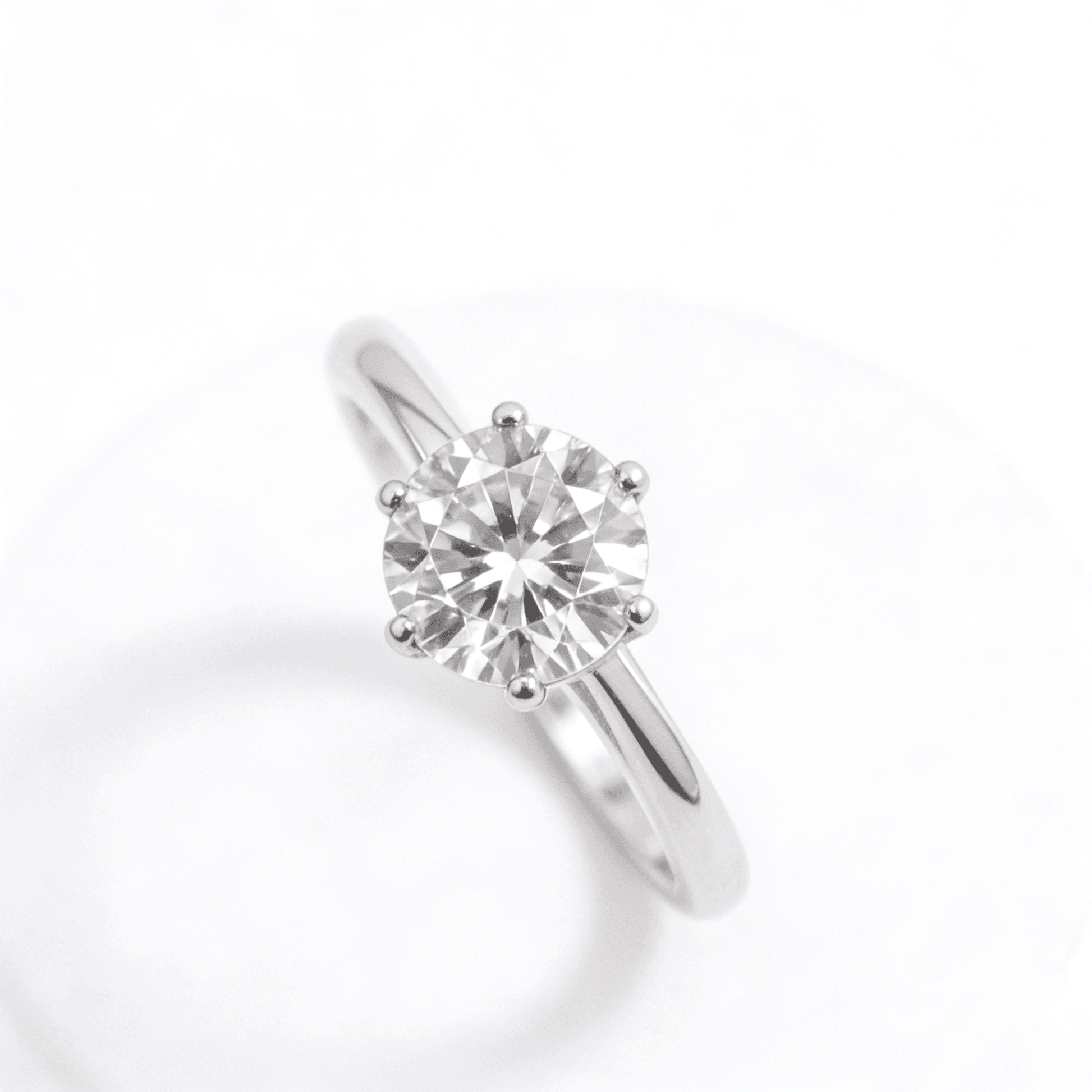 Hand-set zirconia stones on a polished silver band, mirroring unwavering radiance.