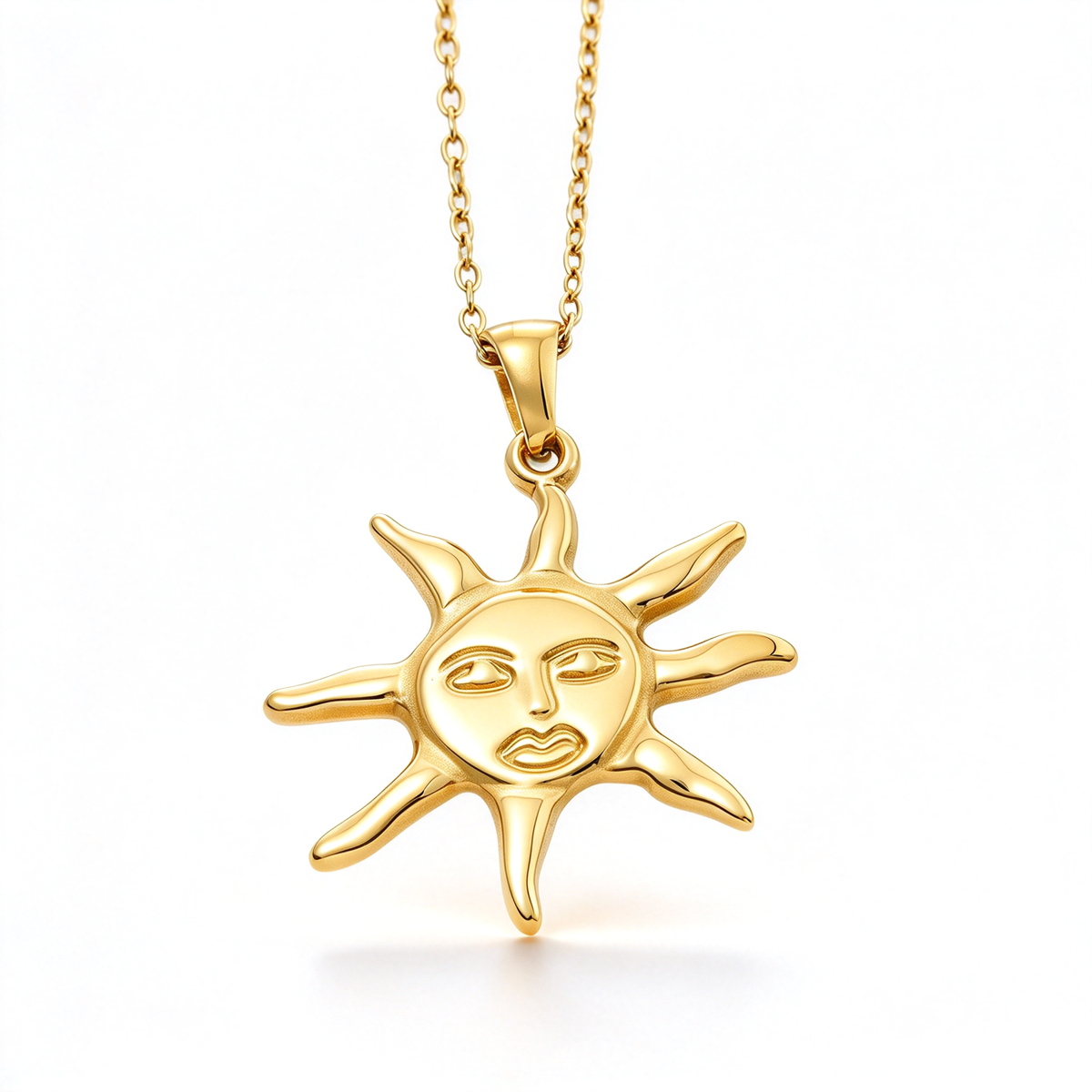 Sun face pendant necklace with a sculpted facial design and radiating rays