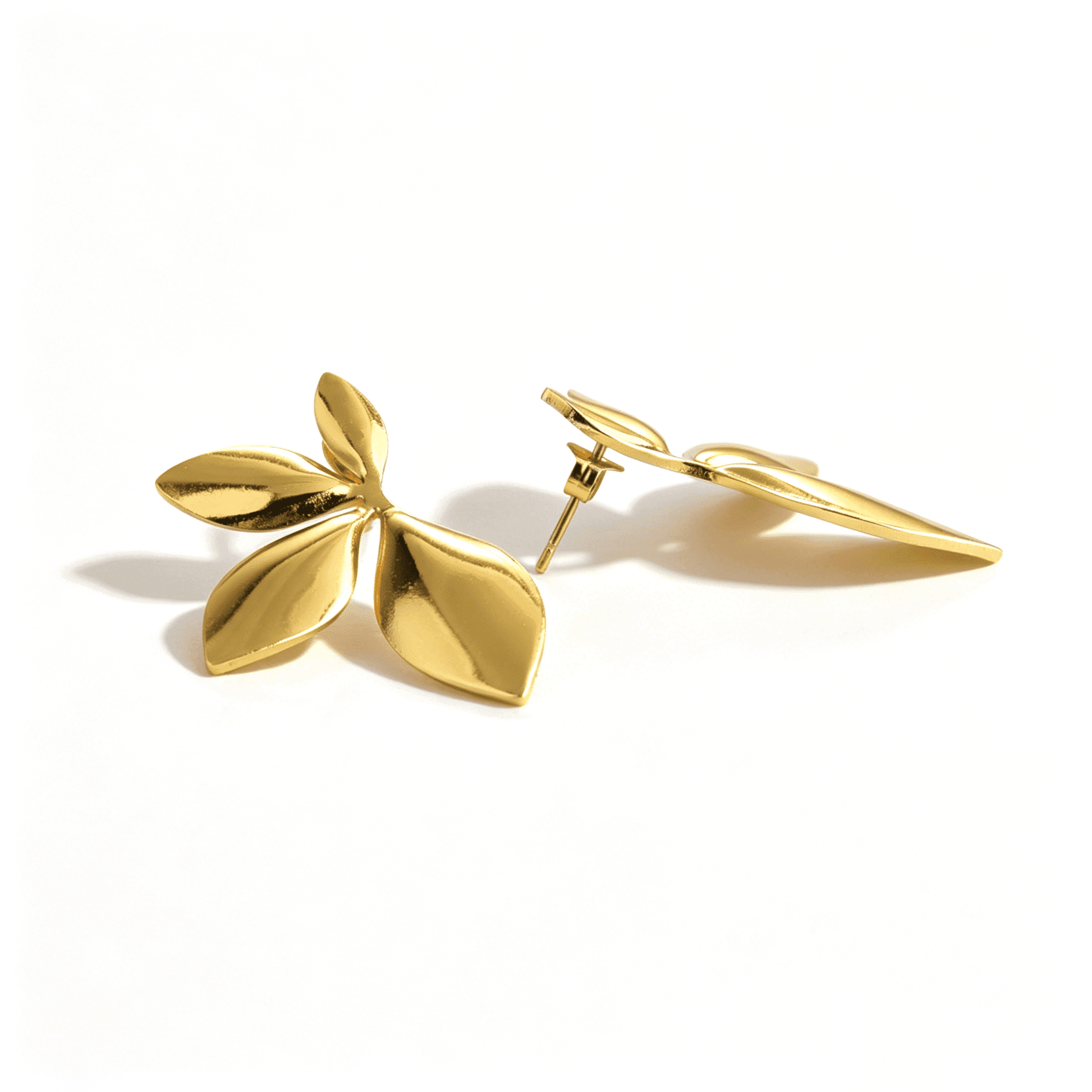 Side view of Ever P. 18k gold plated earrings, highlighting the unique molten metal texture.