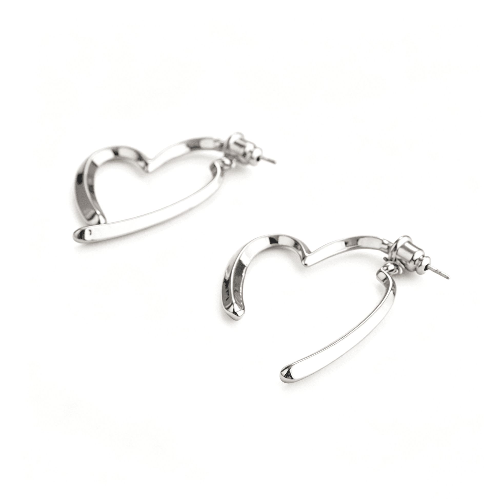 Sleek silver earrings variant displaying the single fluid metallic deconstructed heart shape.