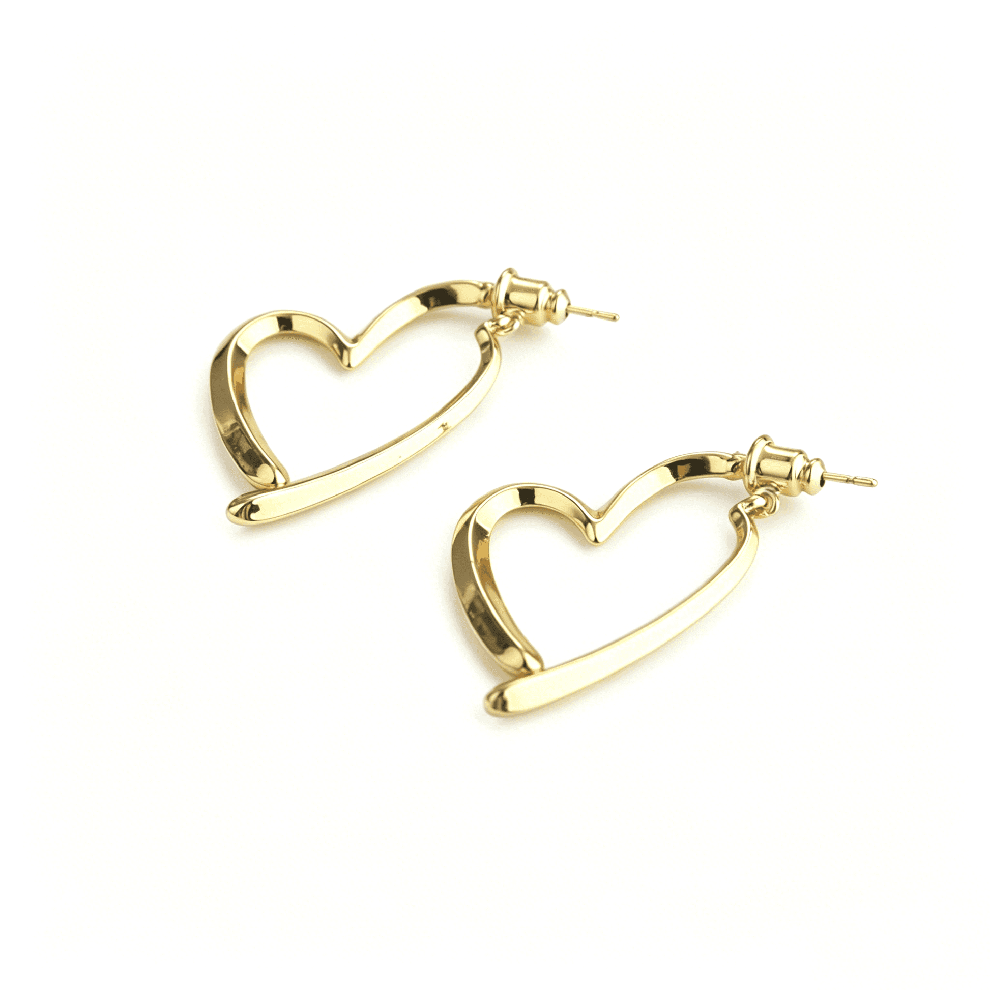 Close-up texture shot of the abstract single heart stud earrings, perfect for quiet luxury style mix and match.