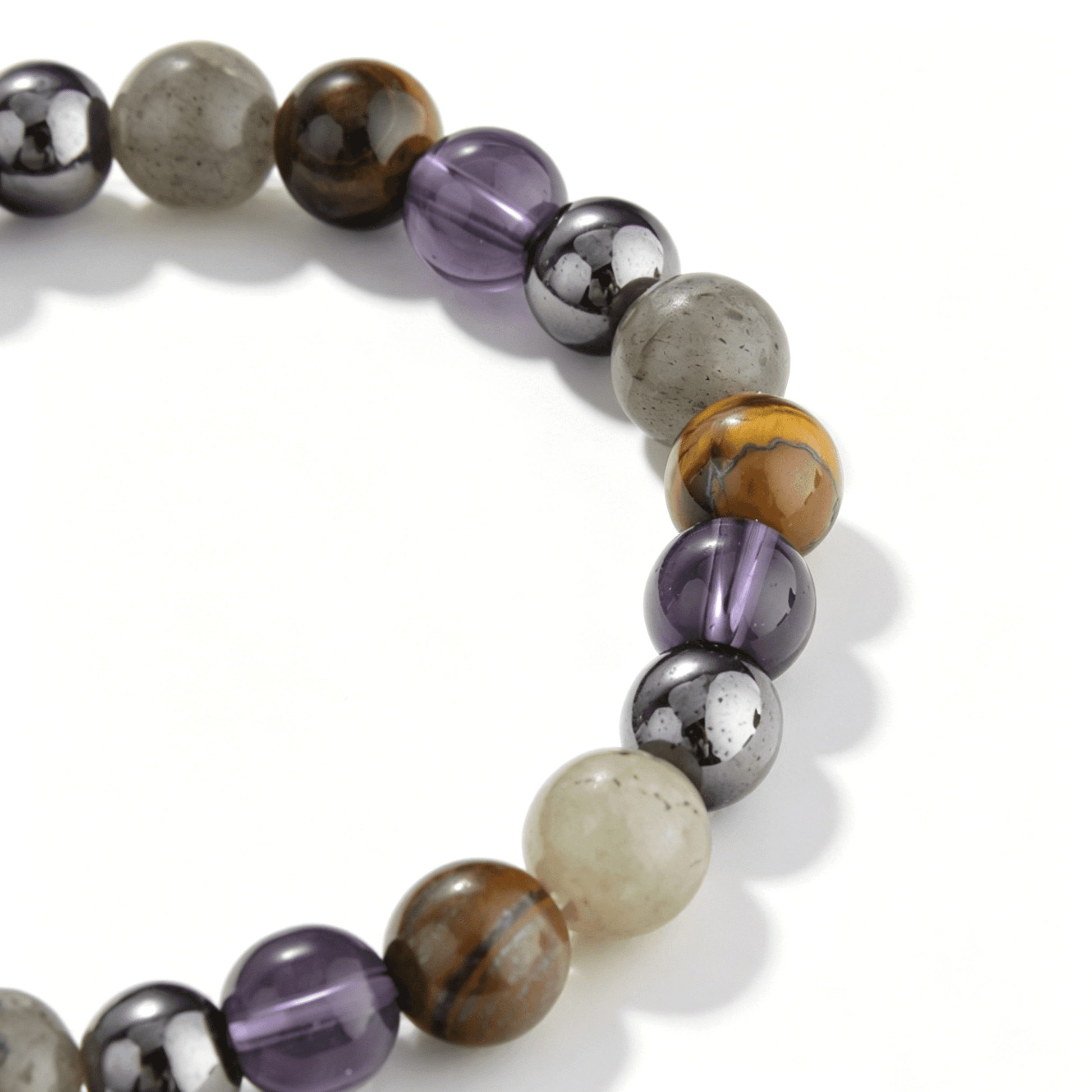 Close-up of Ever P. 6.5mm violet strawberry quartz beads, highlighting the delicate natural inclusions in this beaded bracelet.