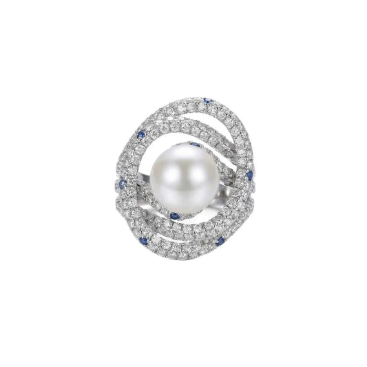 Detailed view of the multi-row crystal and pearl design on an adjustable gold ring.