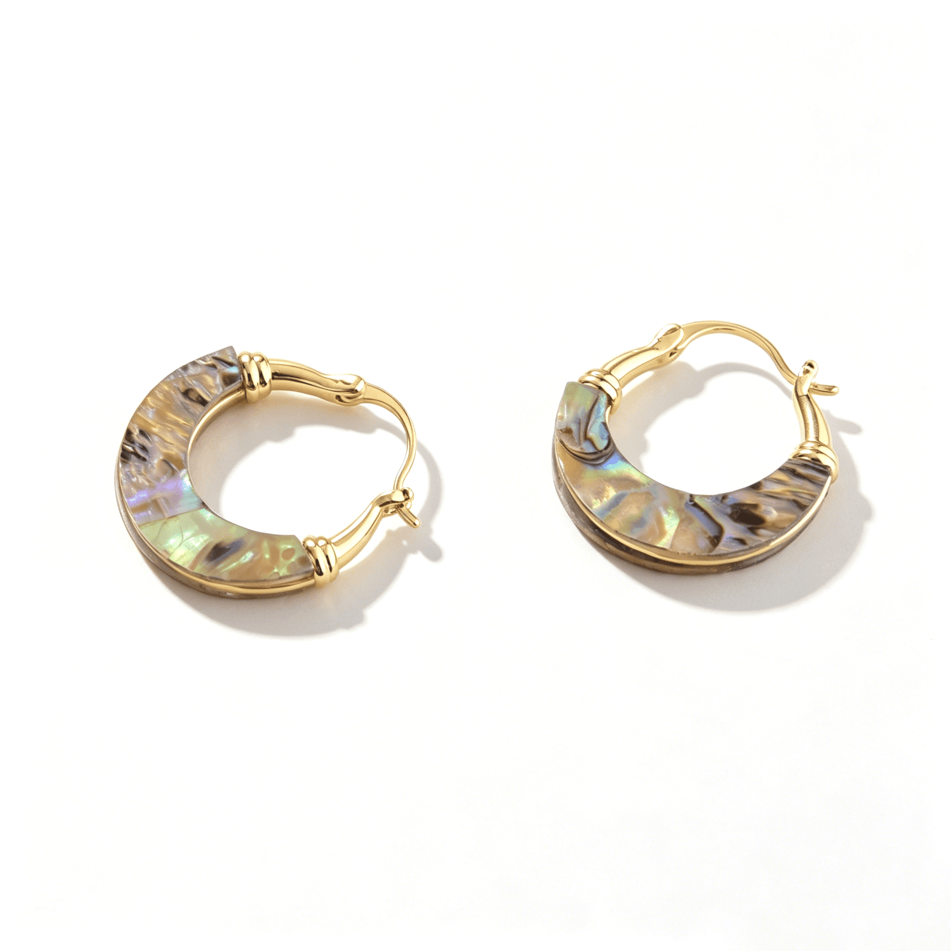 Elegant Ever P. shell hoop earrings, a perfect piece of beach jewelry for a sophisticated coastal look.