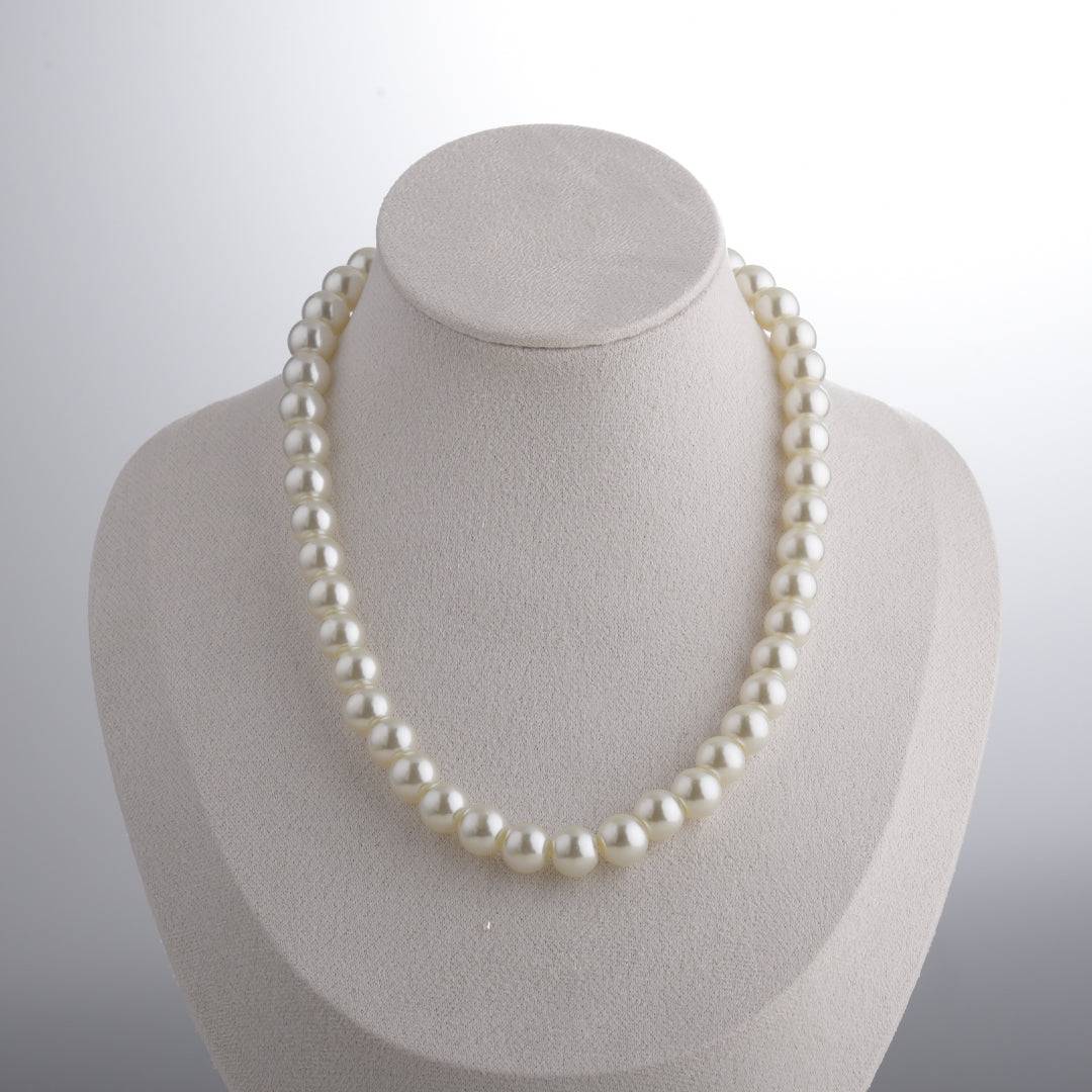 necklace-on-model-reference.jpg	Style reference for the Ever P. butterfly pearl necklace, showing the elegant 41cm collarbone fit on a model.