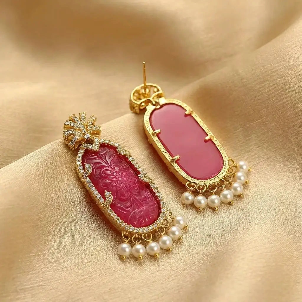 Side view of the gold fringe statement earrings showcasing the cascading tassels.