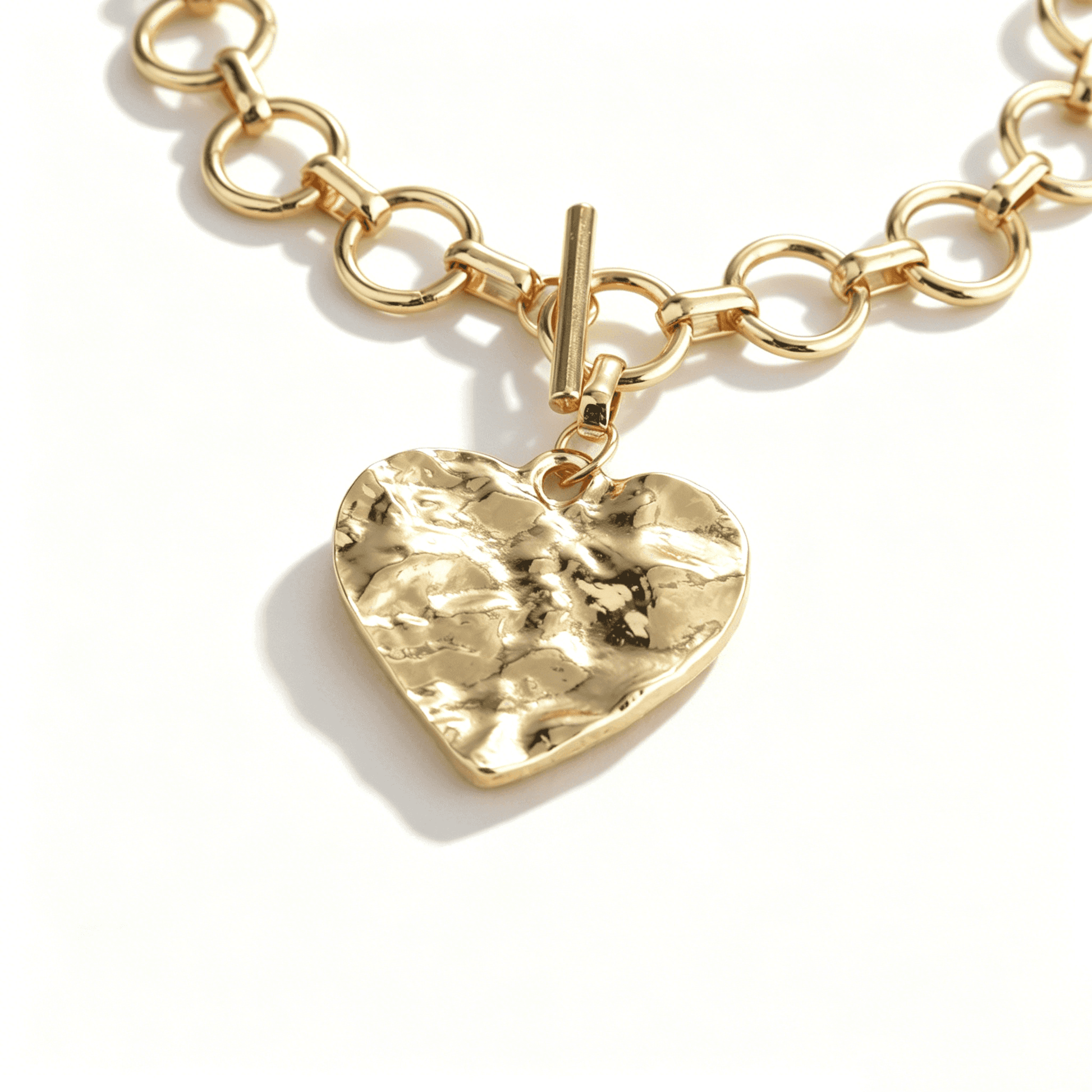 Detail of the secure architectural T-bar (toggle) clasp on the Ever P. gold heart necklace for women.