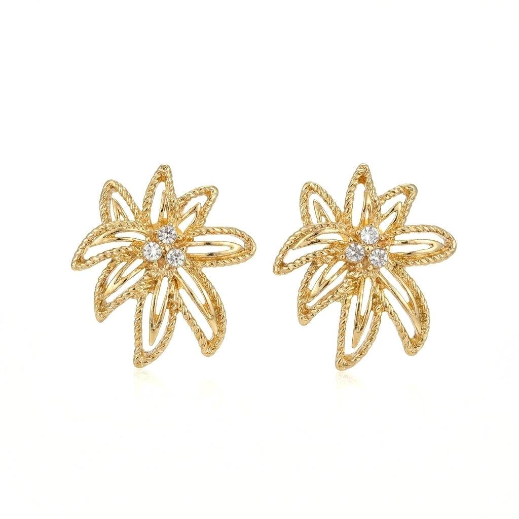 Ever P. gold stud earrings in an intricate hollow-out vintage leaf design.