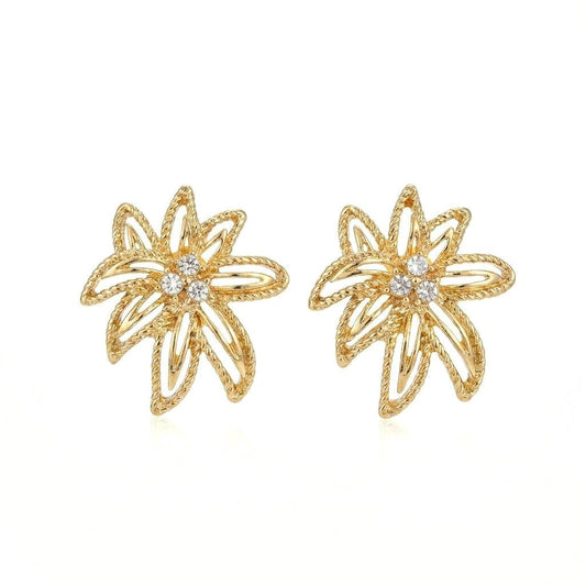 Ever P. gold stud earrings in an intricate hollow-out vintage leaf design.