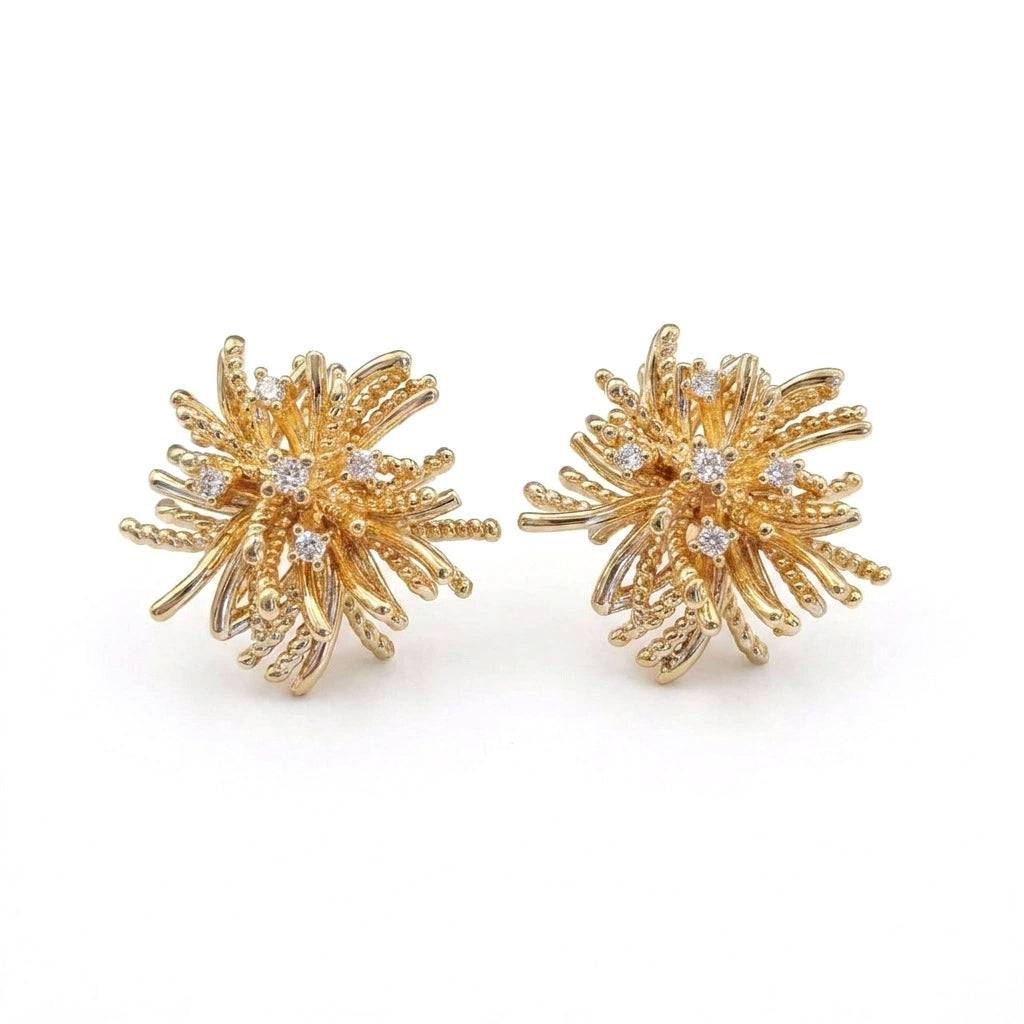 Ever P. gold stud earrings featuring a vintage starburst design with crystal pave.