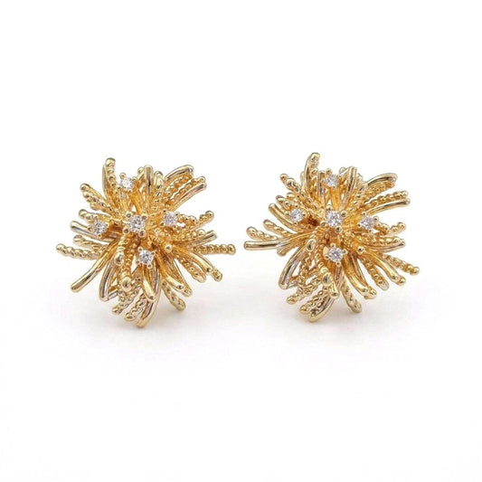 Ever P. gold stud earrings featuring a vintage starburst design with crystal pave.