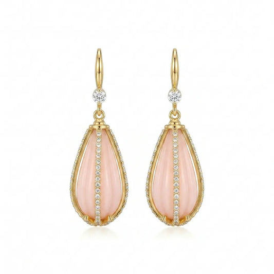 Ever P. gold teardrop earrings with a soft pink crystal stone and ornate filigree frame.
