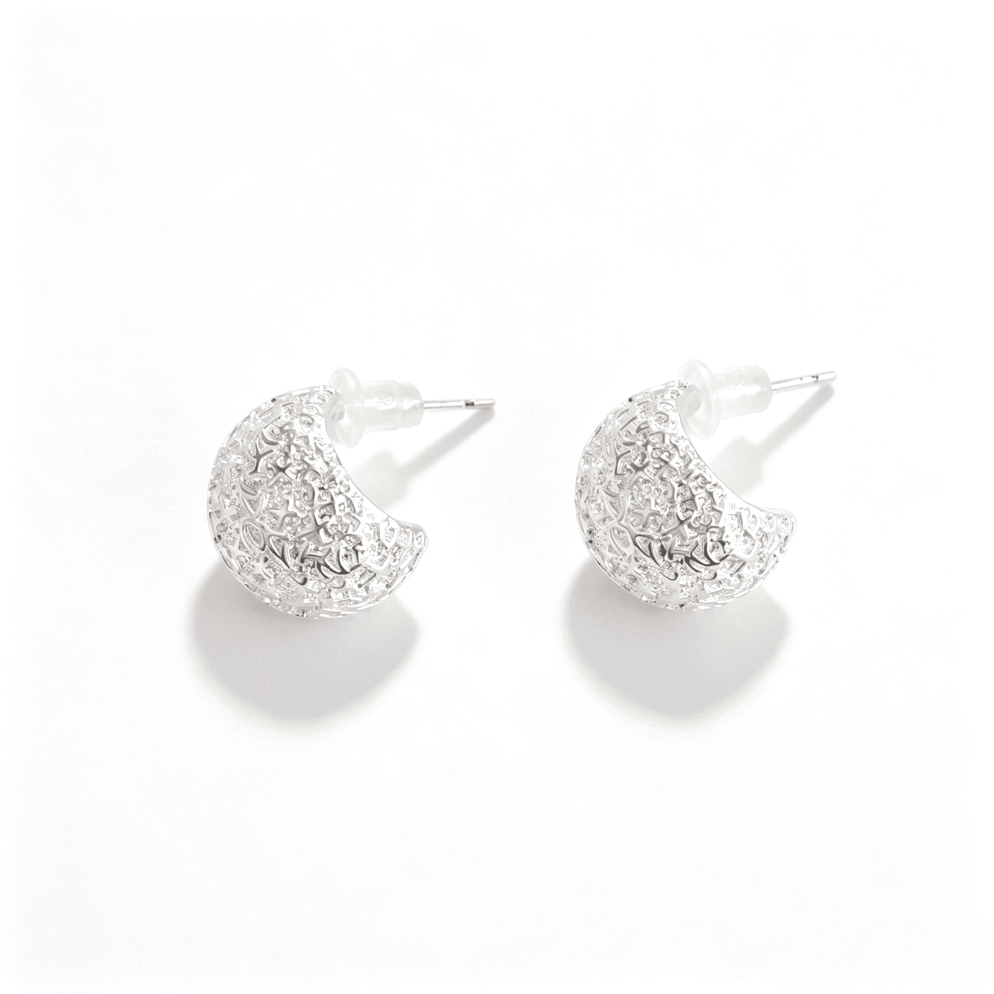 Ever P. hammered silver earrings, featuring a bold chunky hoop design with an artisanal textured finish.