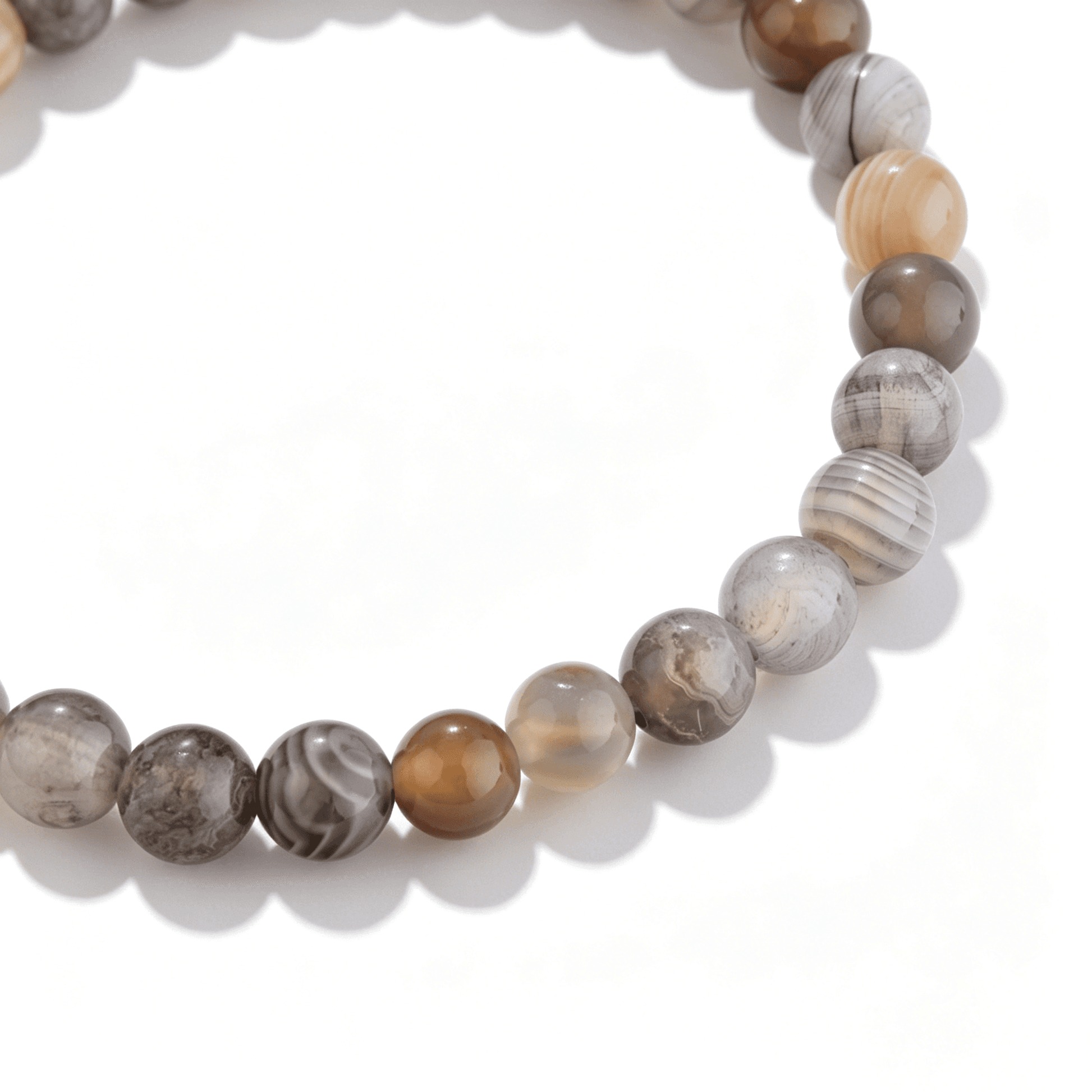 A detailed view of the handmade Persian agate crystal bracelet with smoky grey tones.