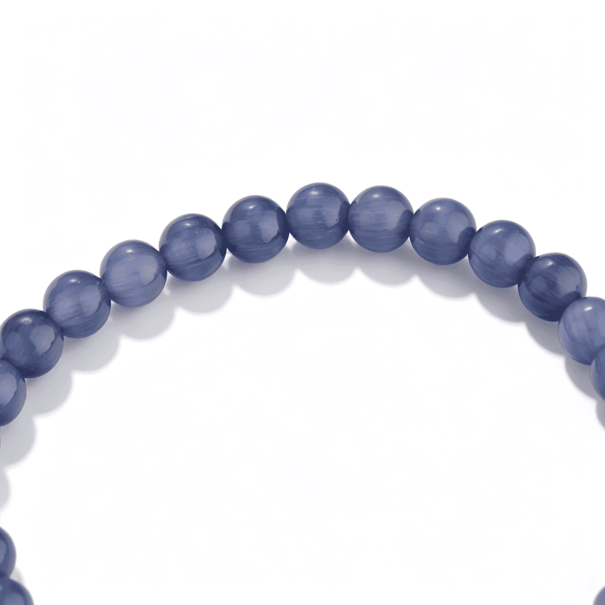 Detailed artisan craftsmanship of the handmade violet agate bead bracelet.