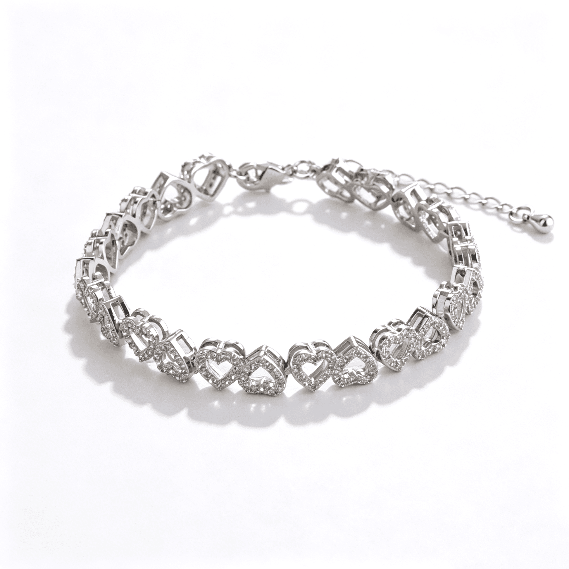 Ever P. heart bracelet featuring interlocking double heart links with full cubic zirconia stones.