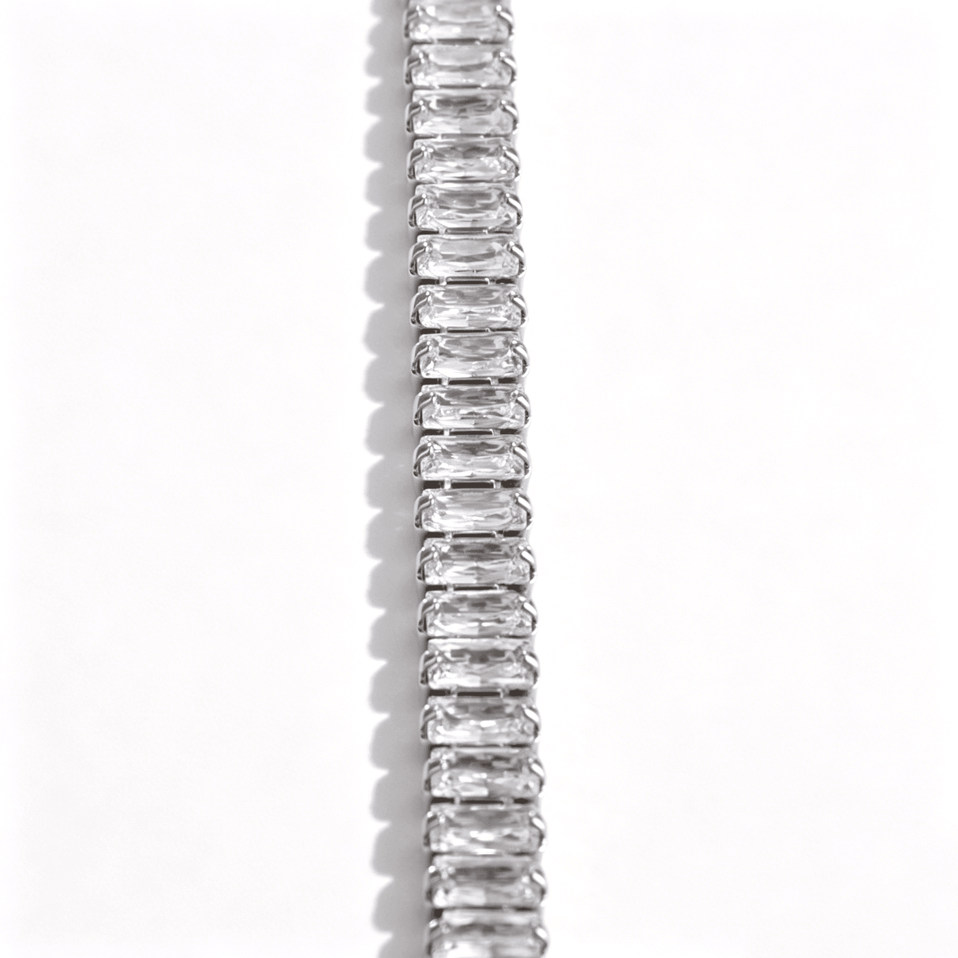 Close-up of the secure safety clasp on the Ever P. iced out bracelet, highlighting the seamless stone setting.