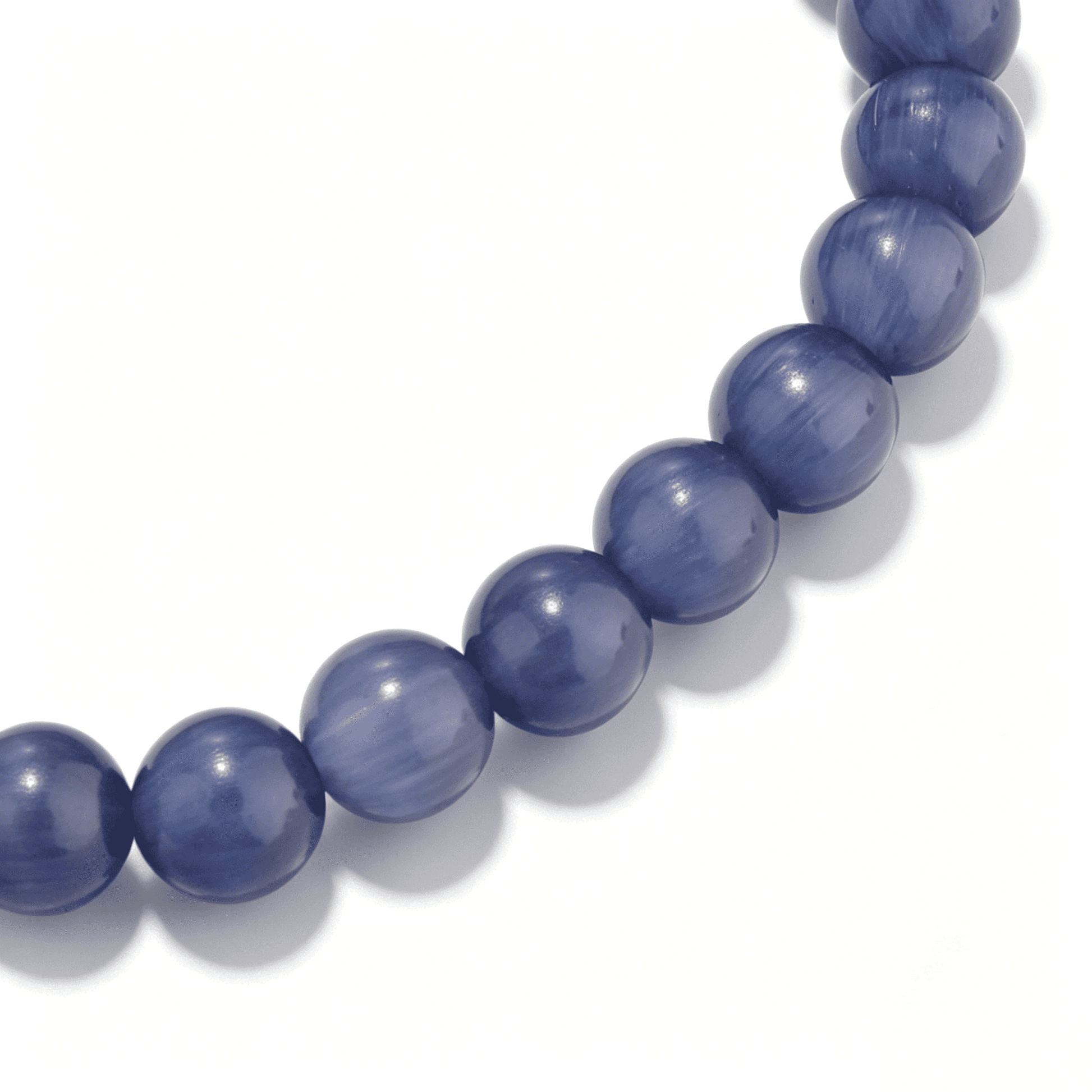 Close-up of the Ever P. Indigo Wave bracelet showing deep violet agate textures.
