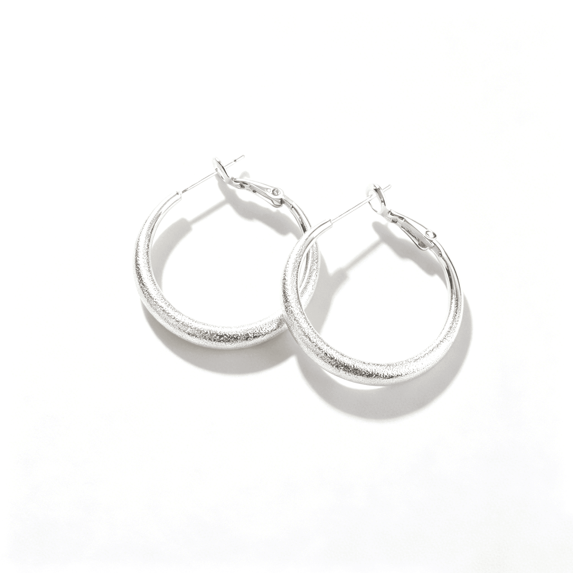 Ever P. large silver hoops featuring a bold 3.2cm tube design and high-polish mirror finish.
