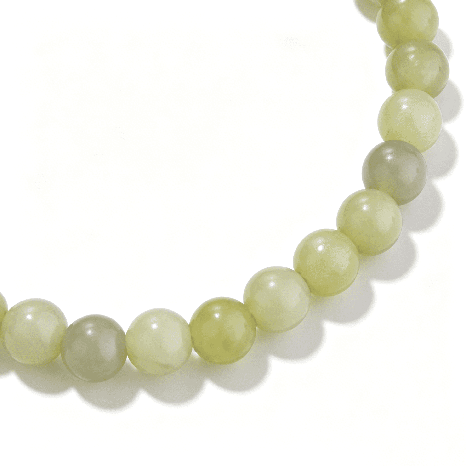 Close-up of the Ever P. Lime Dew bracelet showing the translucent glow of the green beads.