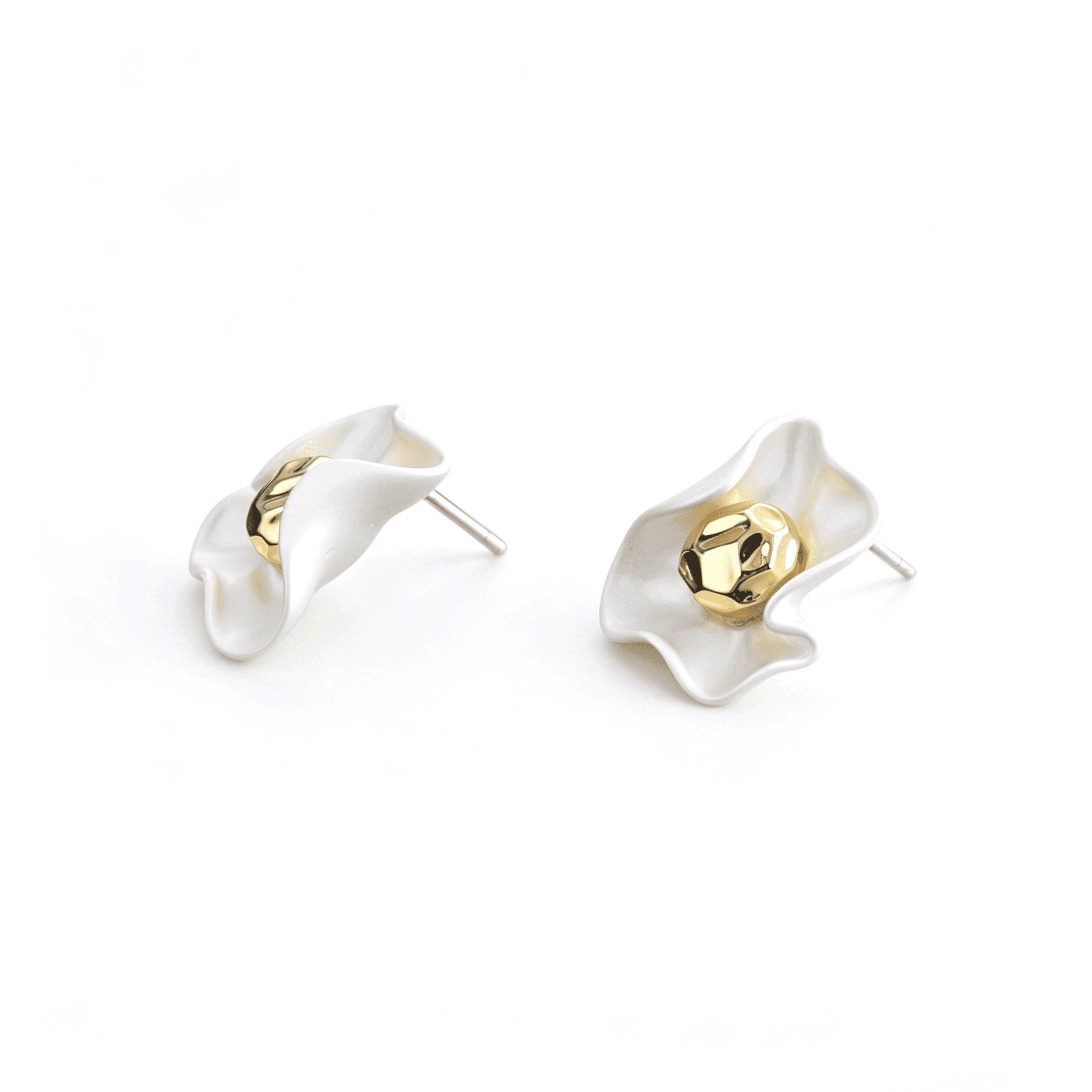 Side perspective of the sculptural floral earrings, emphasizing the 1.5*2cm profile and secure earring post.