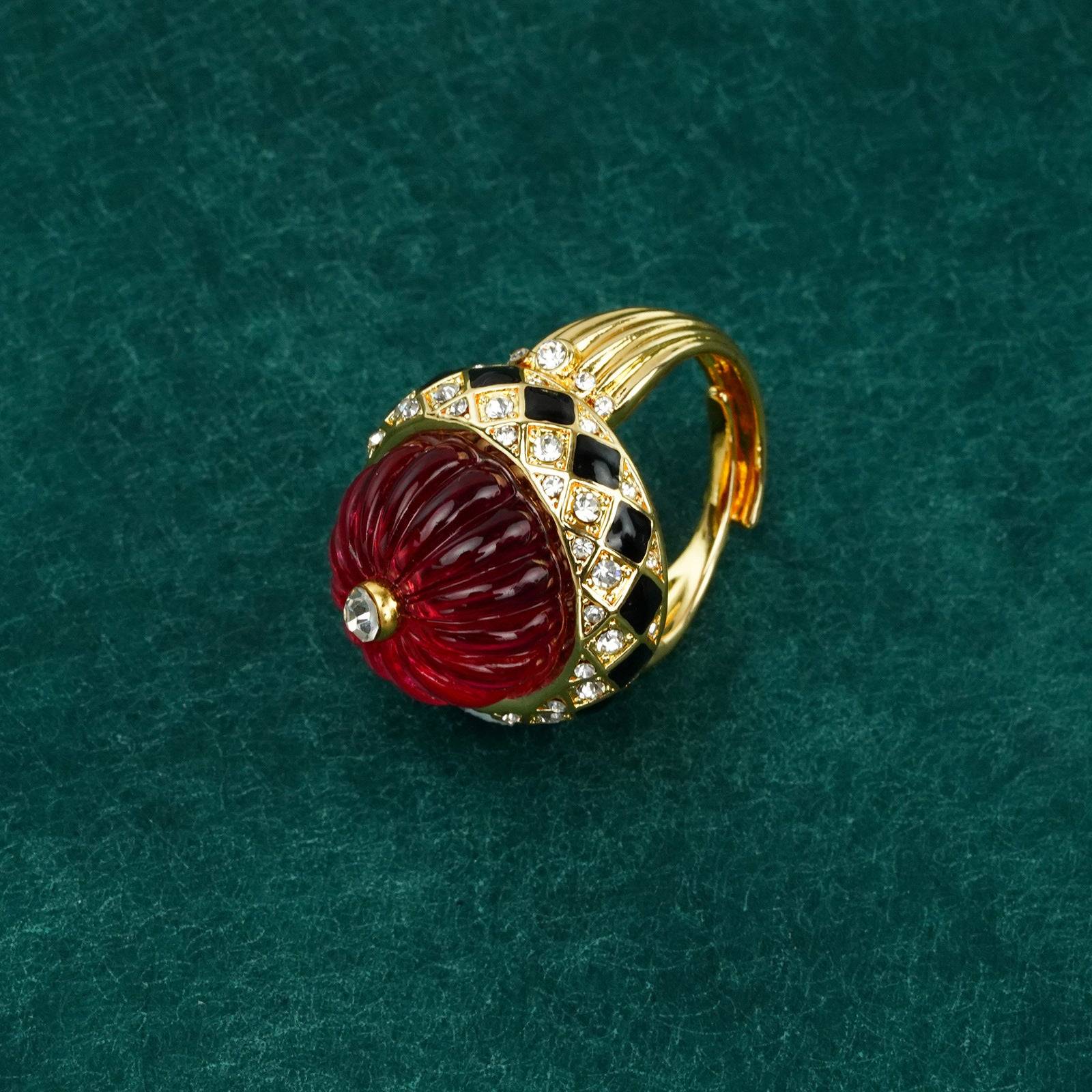 Detailed perspective showcasing the faceted light-catching surface of the textured gold ring statement piece.