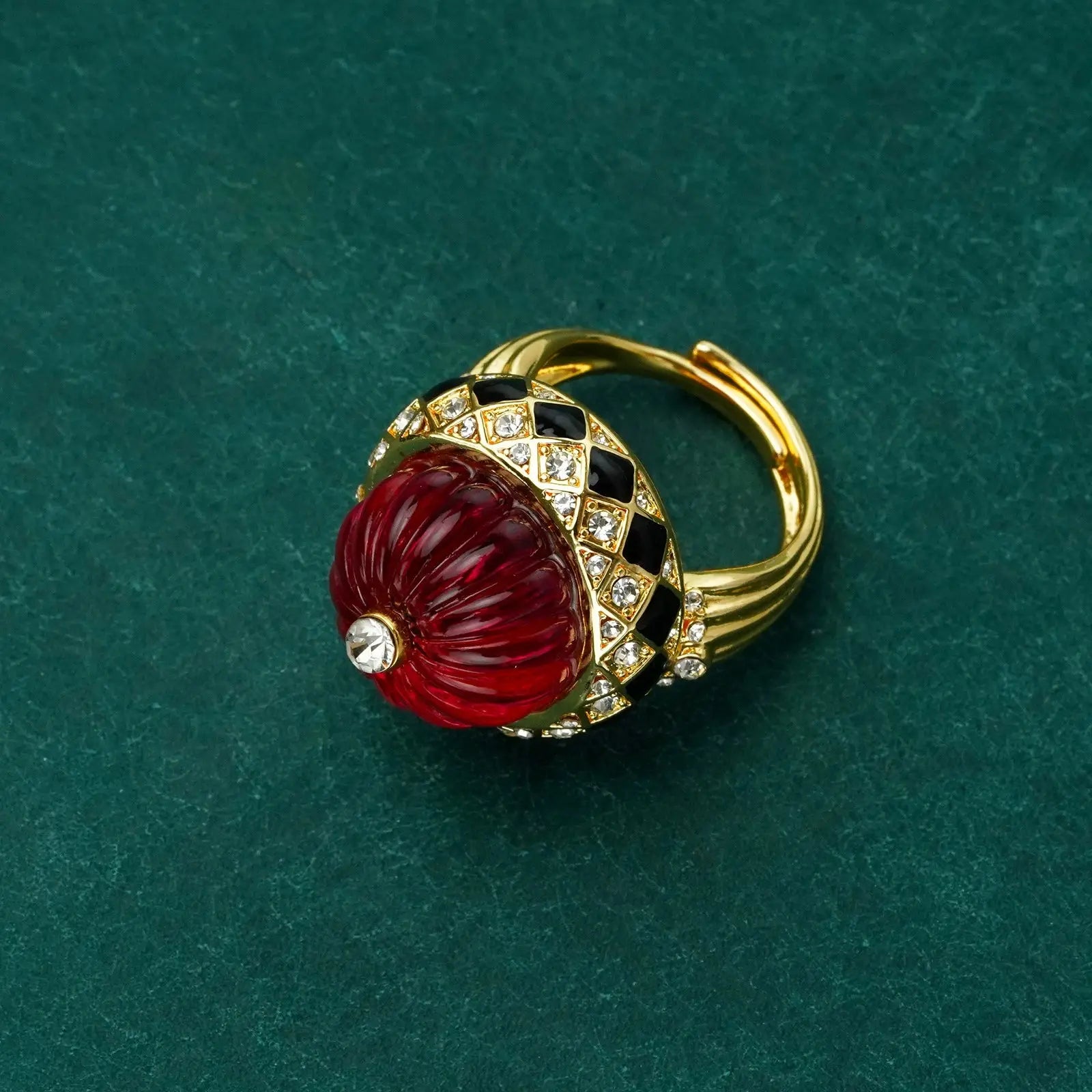 Studio product angle displaying the clean circular shield silhouette and polished 18k gold plating.