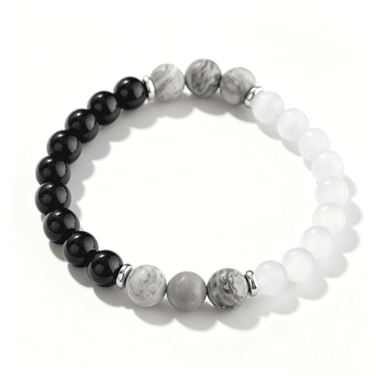 Overhead full view of an Ever P. monochrome beaded bracelet, showcasing the black, white, and detailed grey stone mix on a clean white background.