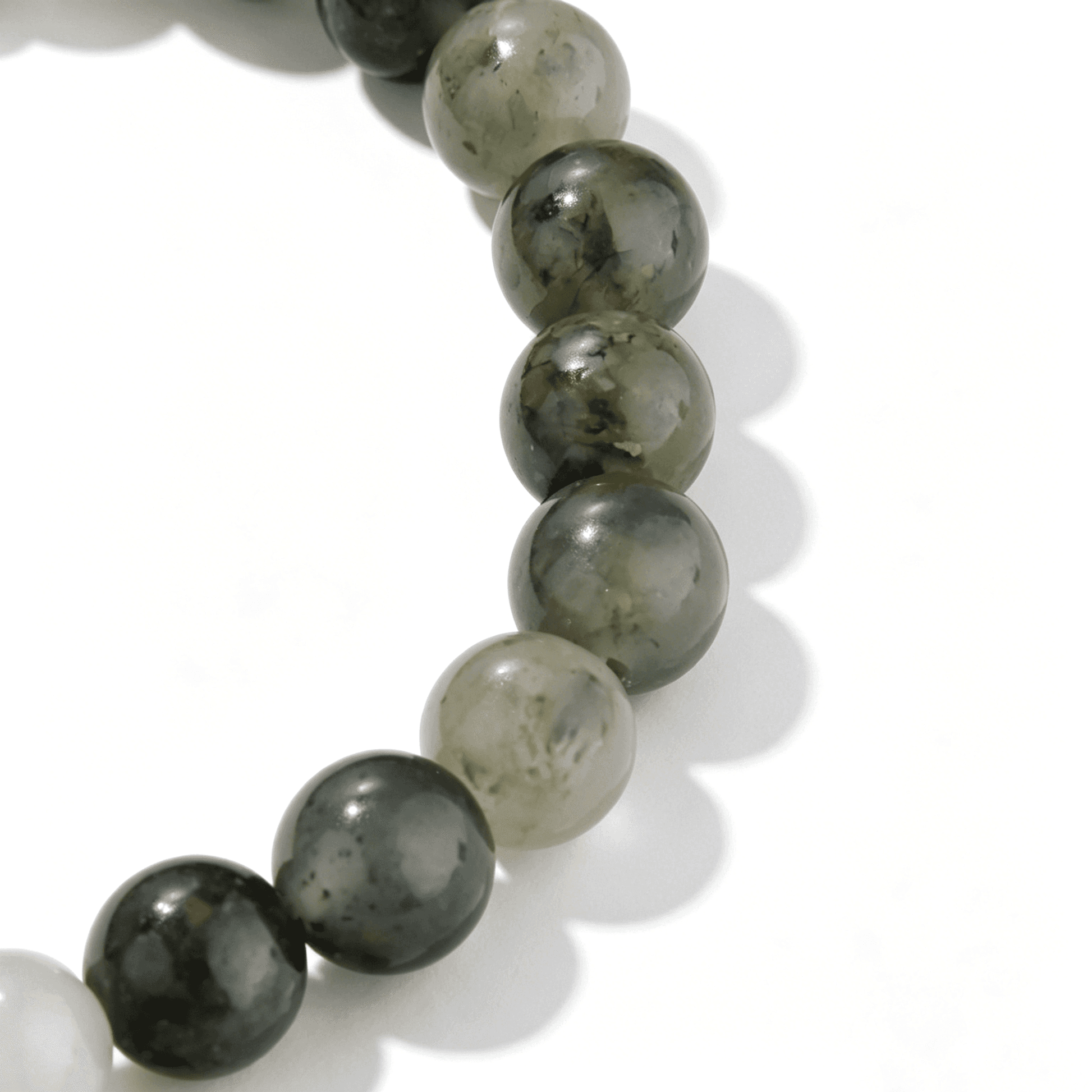 Close-up of Ever P. Moss Red agate bracelet showing natural green and red mineral patterns.