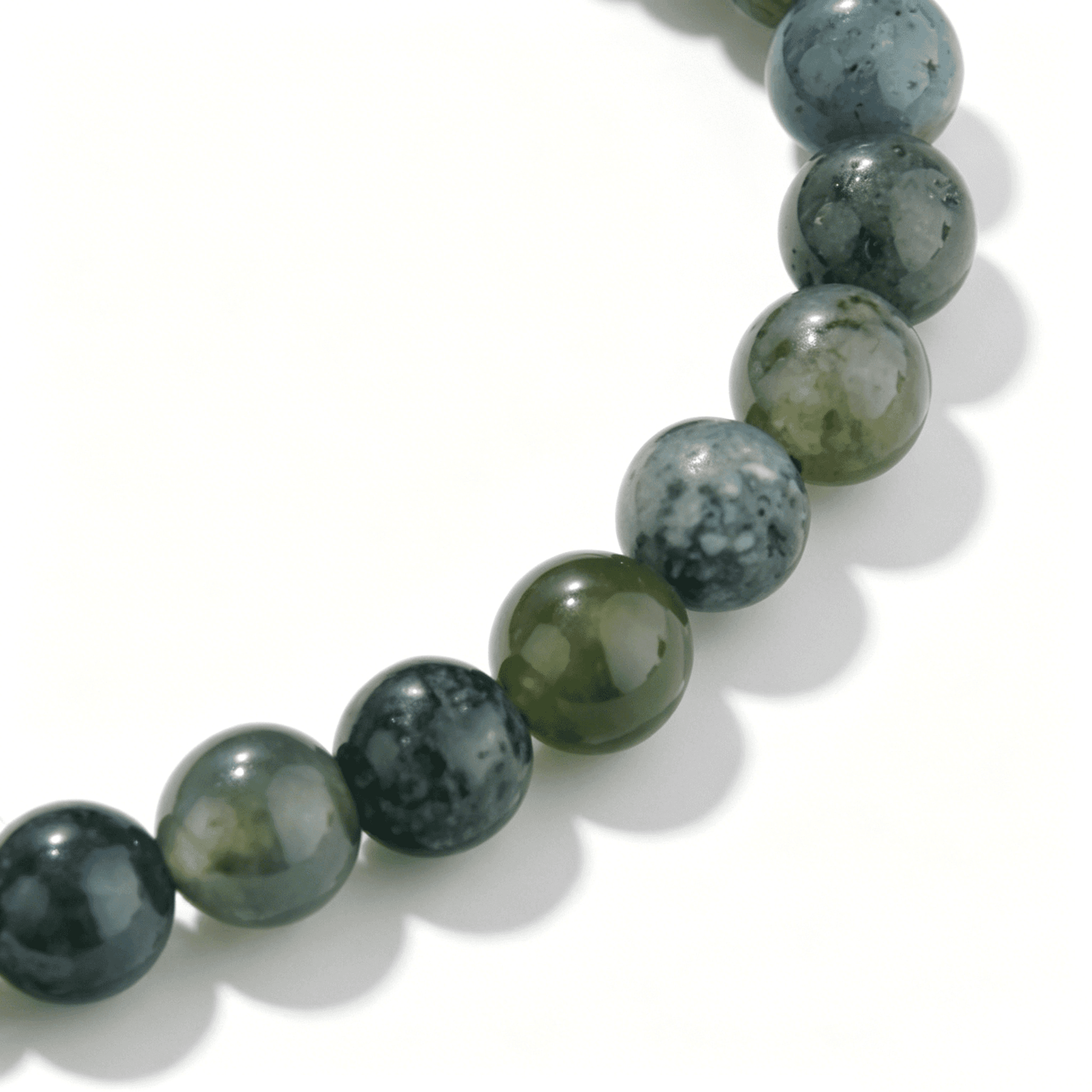 Close-up of Ever P. Moss Vein agate bracelet showing natural green botanical patterns.