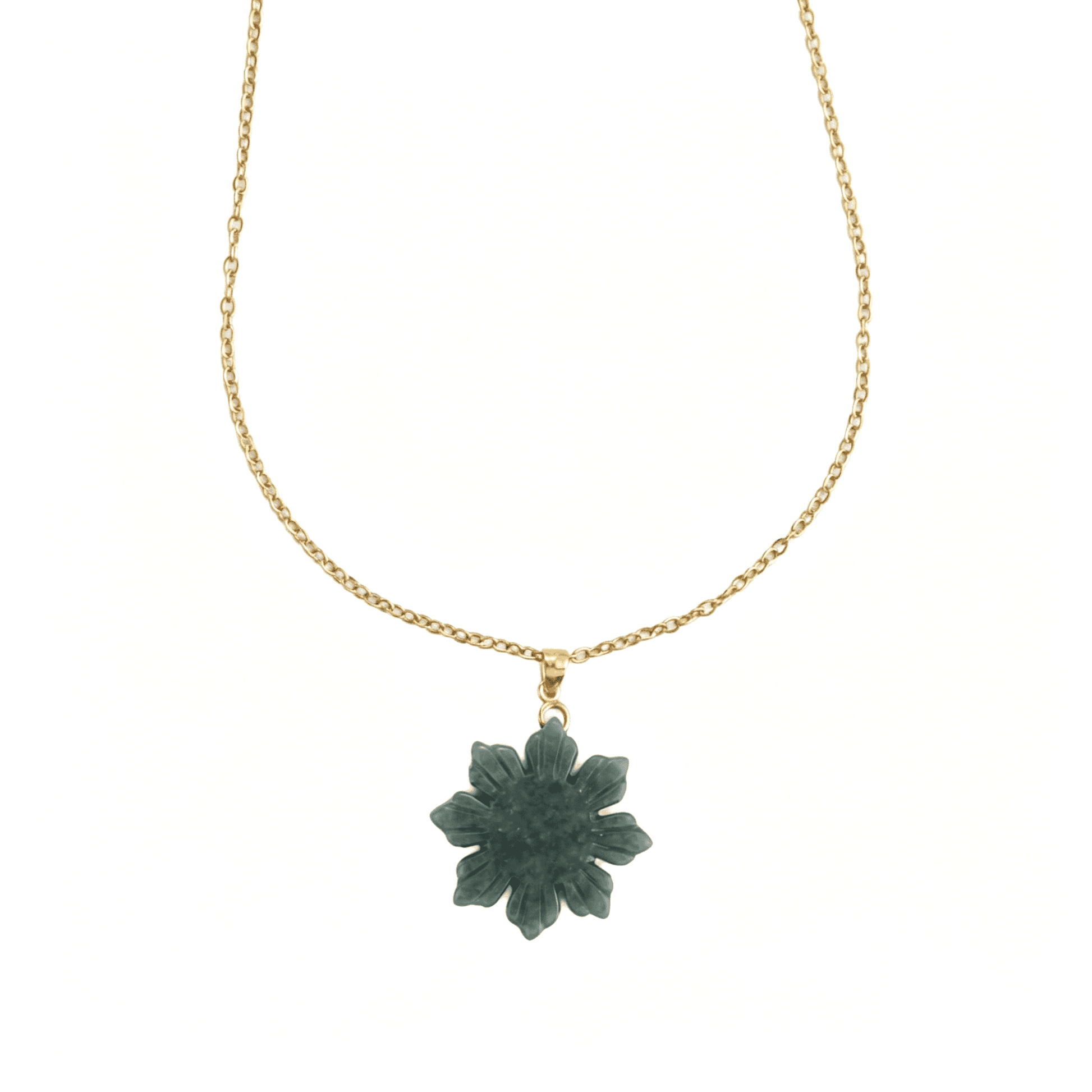 Front aesthetic view of the Ever P. natural green jade pendant carved in a textured sunflower motif.