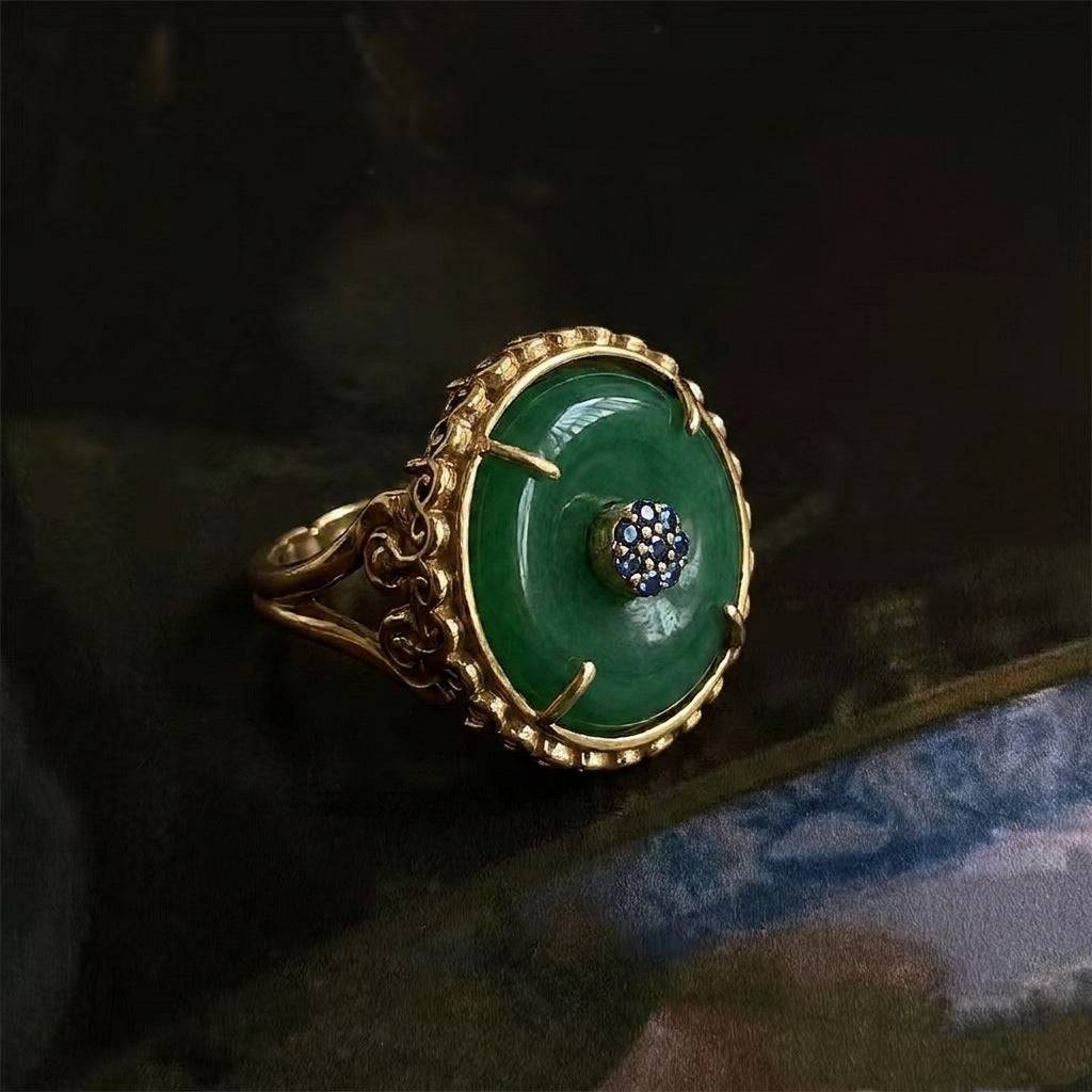 Full sculptural view of the New Chinese statement ring with green resin and gold finish.