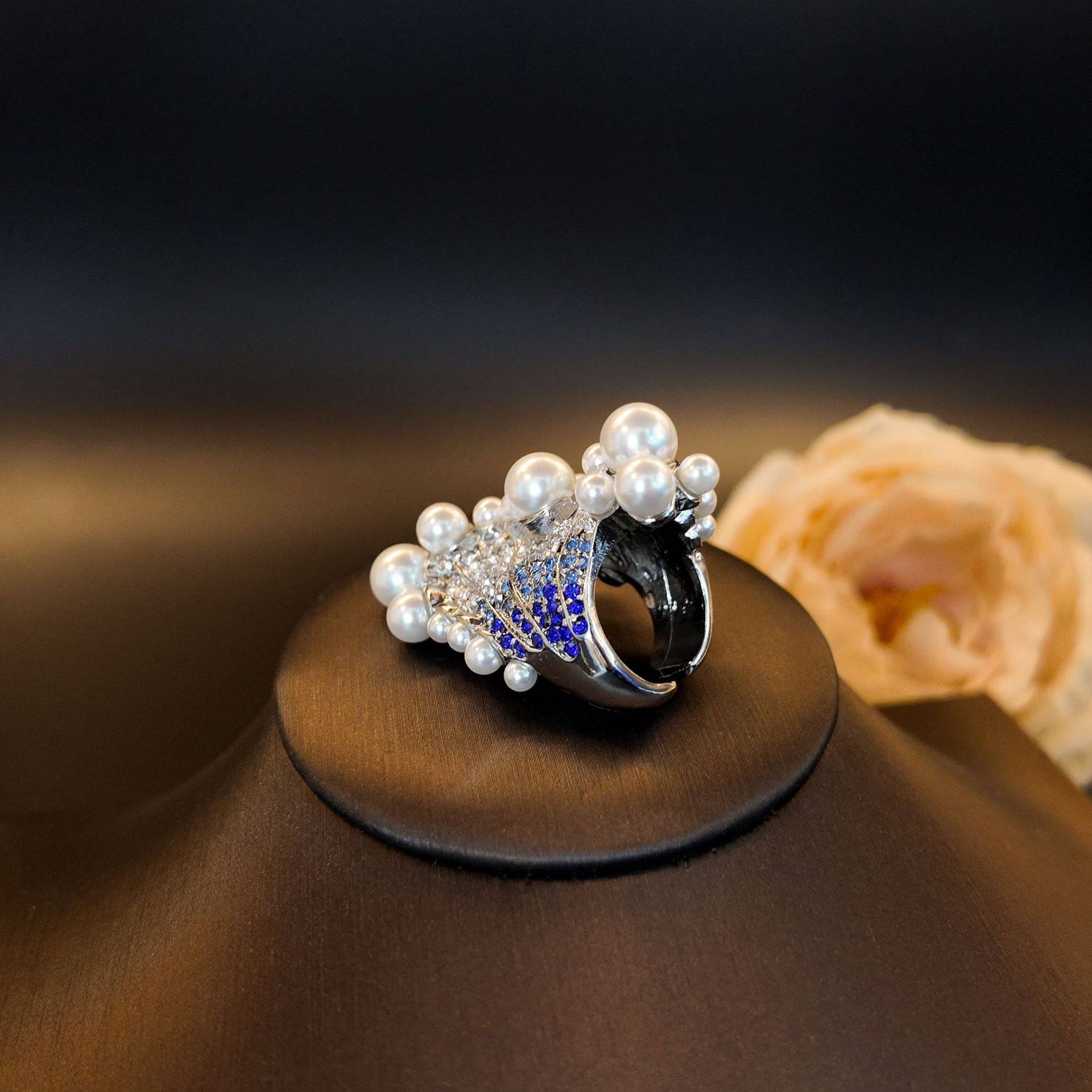 Back view of the cocktail piece, displaying the adjustable ring open band and comfortable wide silver shank.
