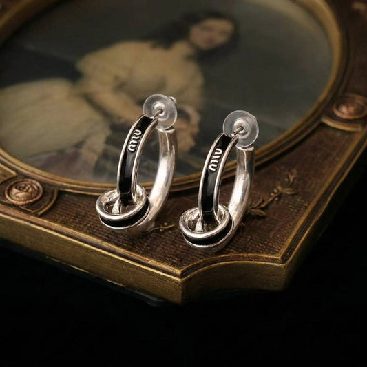 Side view of the old money jewelry aesthetic showcasing the multi-layered C hoop earrings.