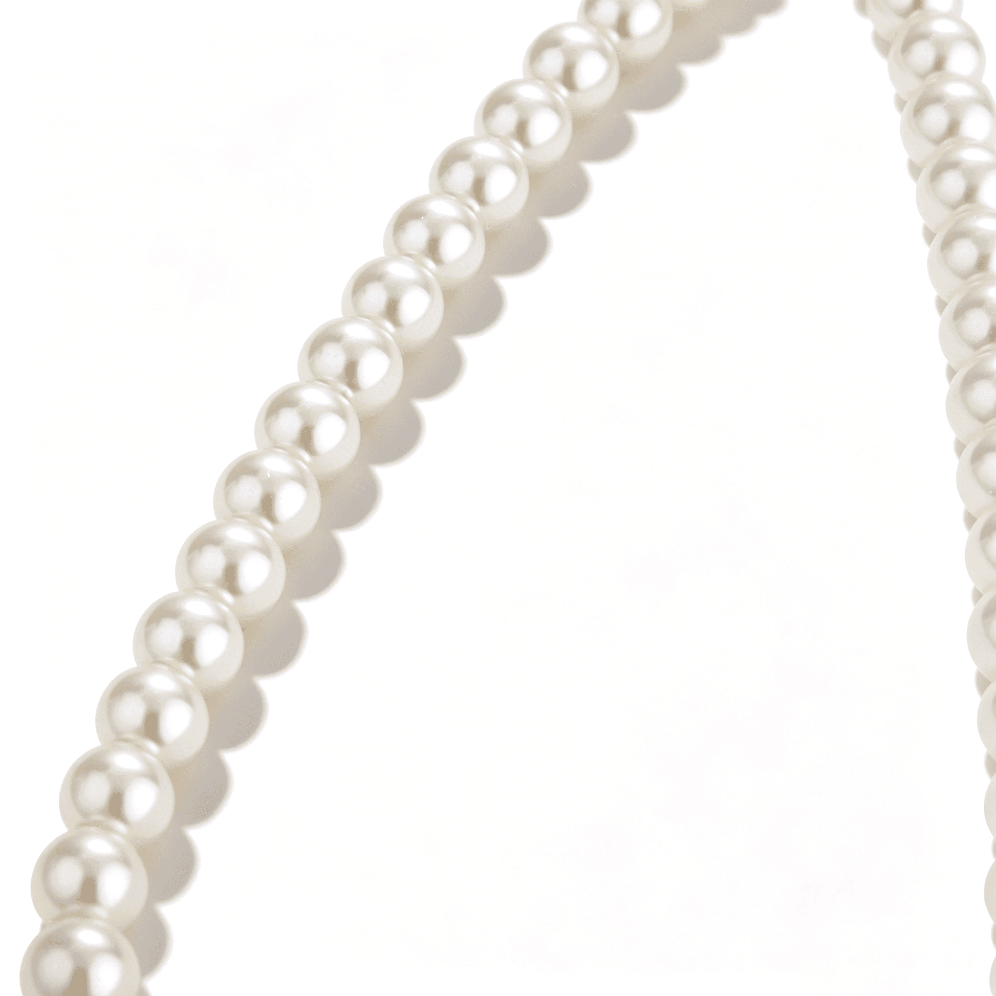 Close-up of the Ever P. pearl pendant necklace, highlighting the intricate gold butterfly and high-luster 10mm pearl.