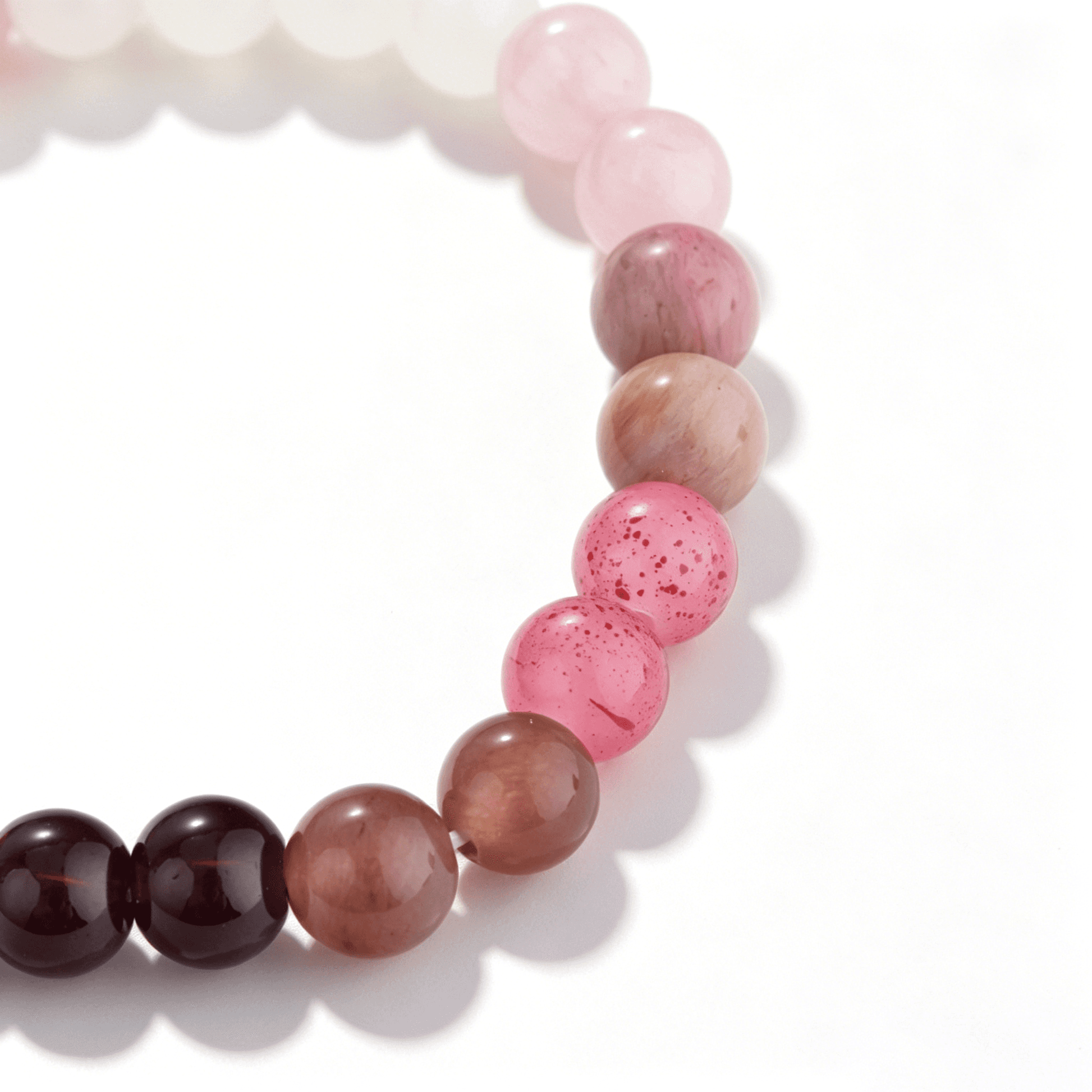A collection of Ever P. gemstone bracelets showcasing the rich, mystical purple hues and natural speckled textures of strawberry quartz.