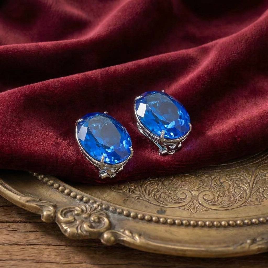 Close-up of the sunburst carving on Ever P. royal blue statement earrings.