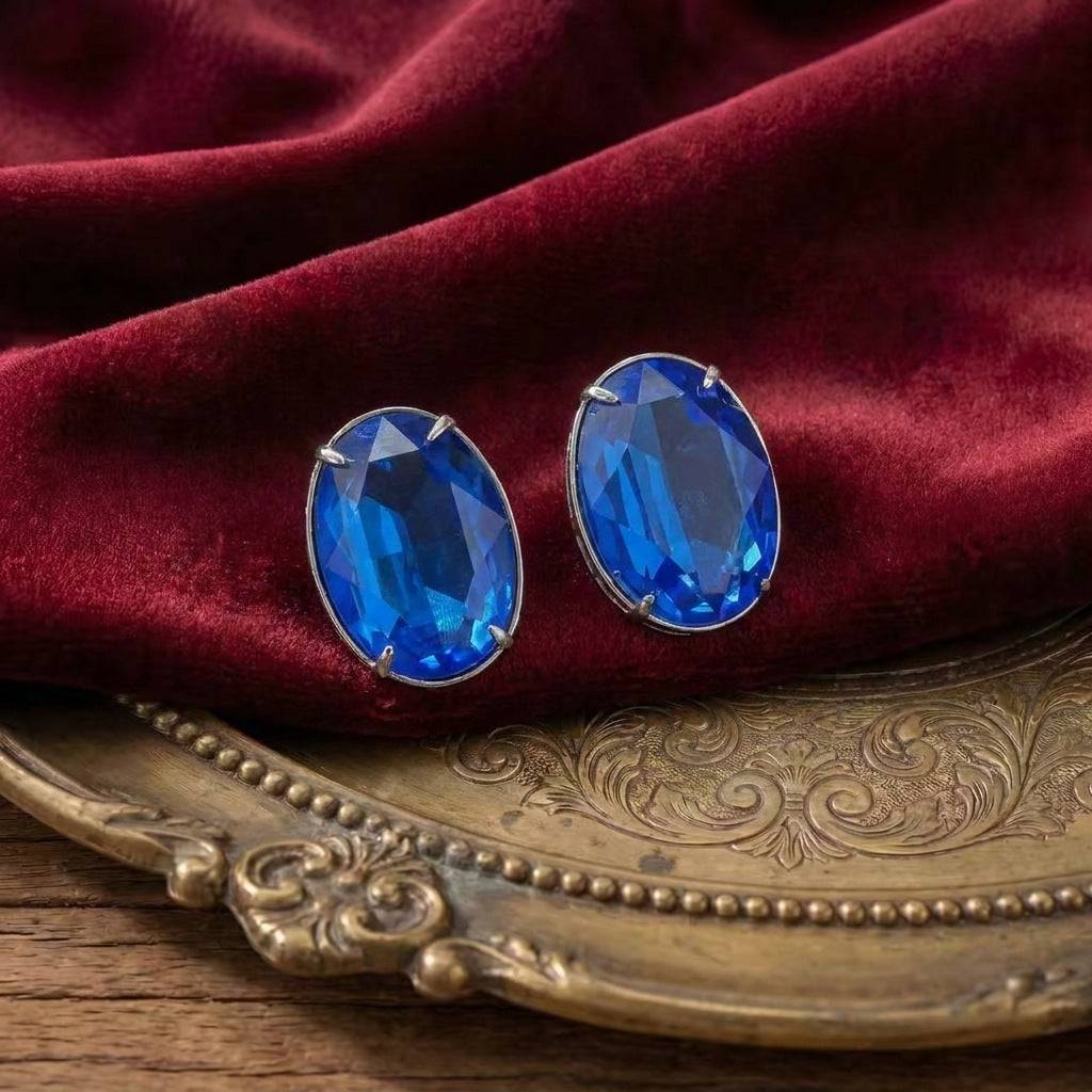 Side perspective of the Ever P. sapphire blue drop earrings for evening wear.