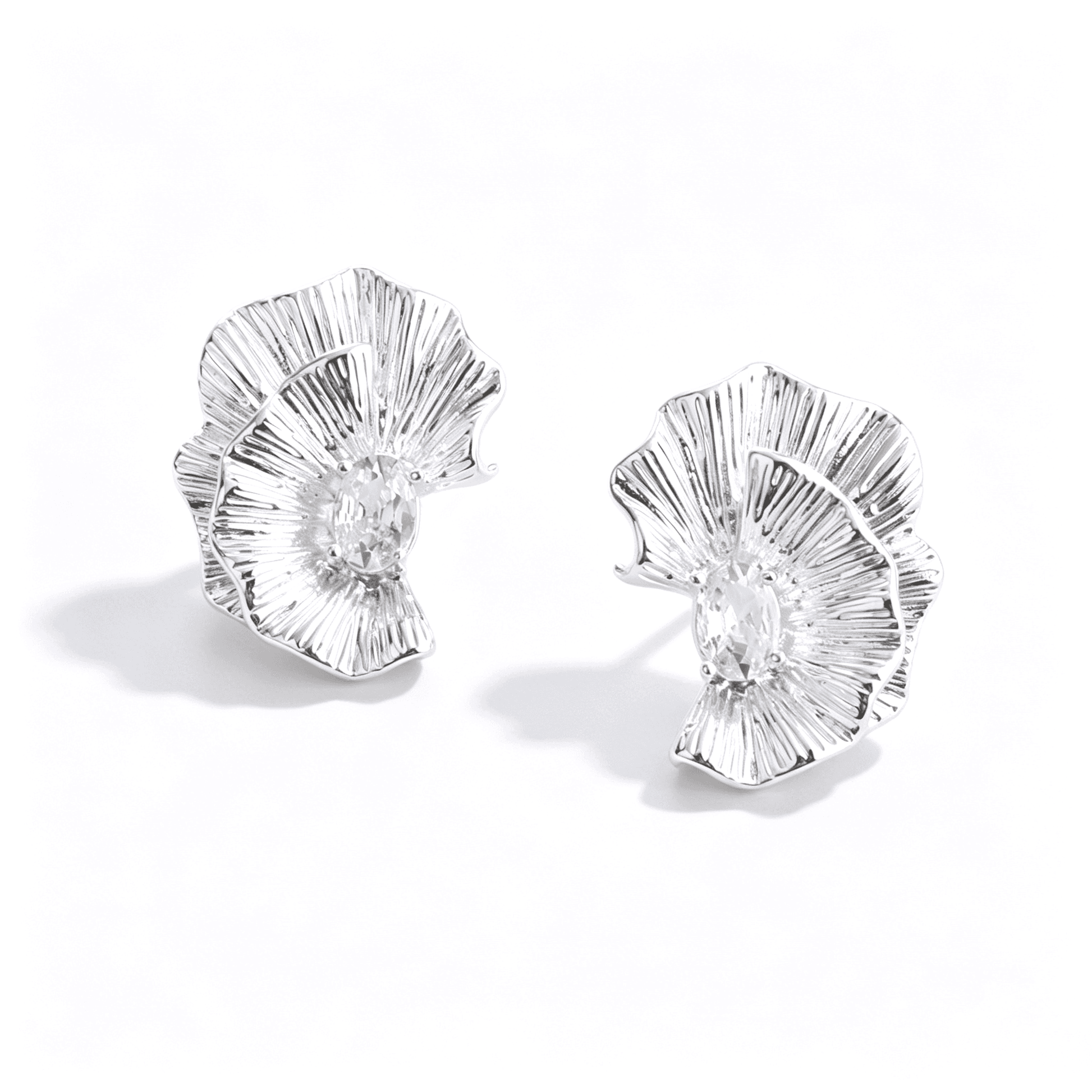 Lifestyle view of the Ever P. silver flower earrings, showcasing the 2.5cm size and elegant fit.