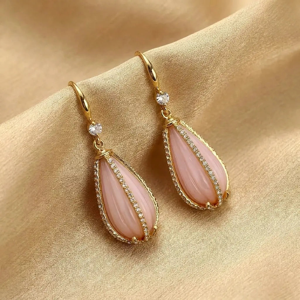 High-definition texture detail of the baroque framed teardrop earrings gold by Ever P.
