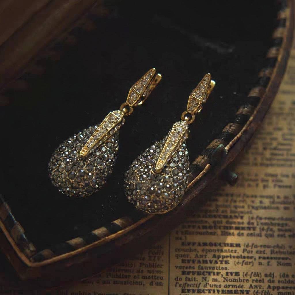 Scale and texture view of the Ever P. statement teardrop stud earrings.