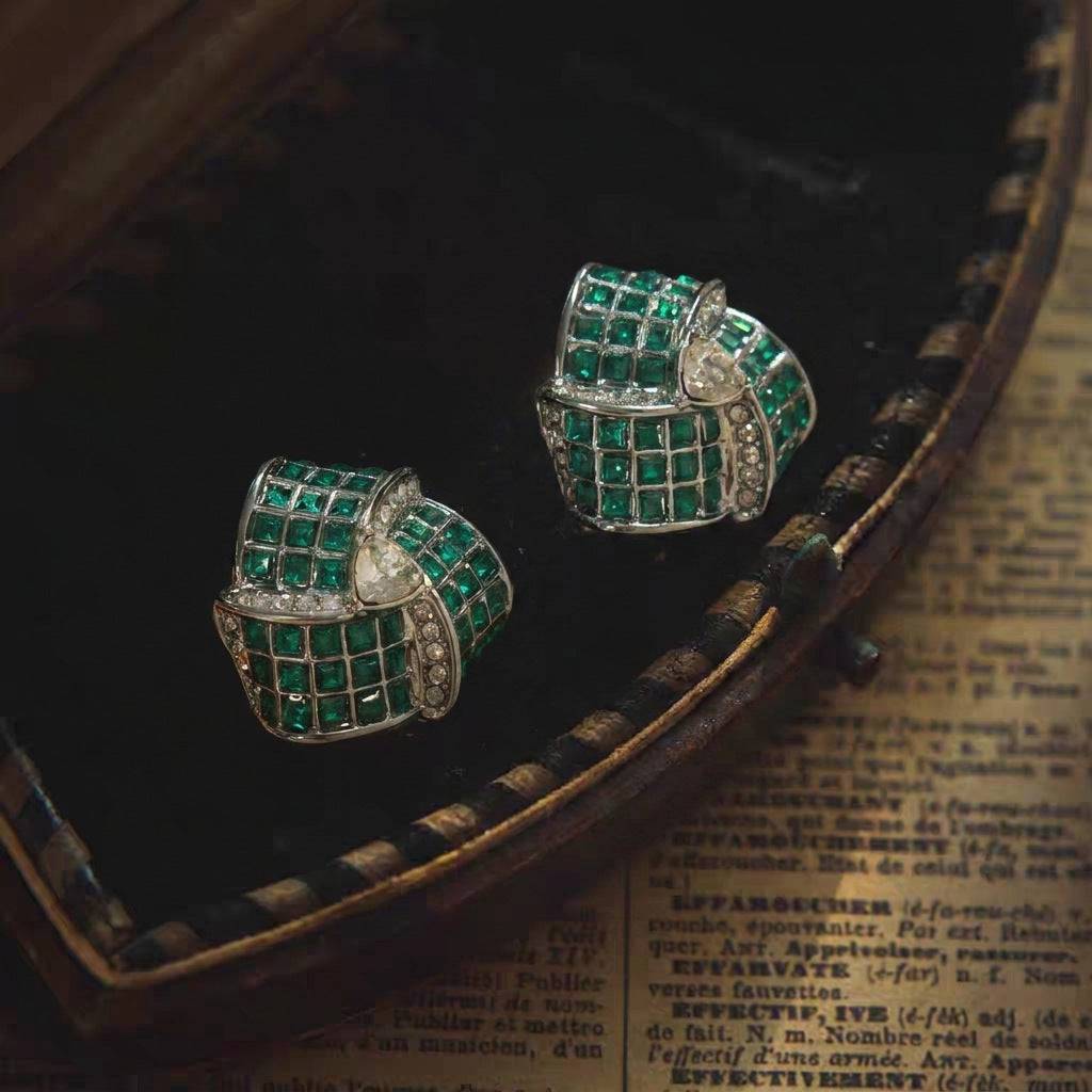 Front view of the victorian gothic revival style earrings in forest green.