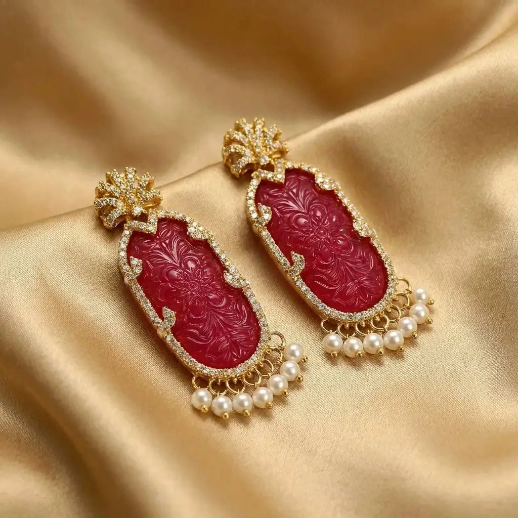 Detailed perspective of the Victorian revival style magenta dangle earrings.