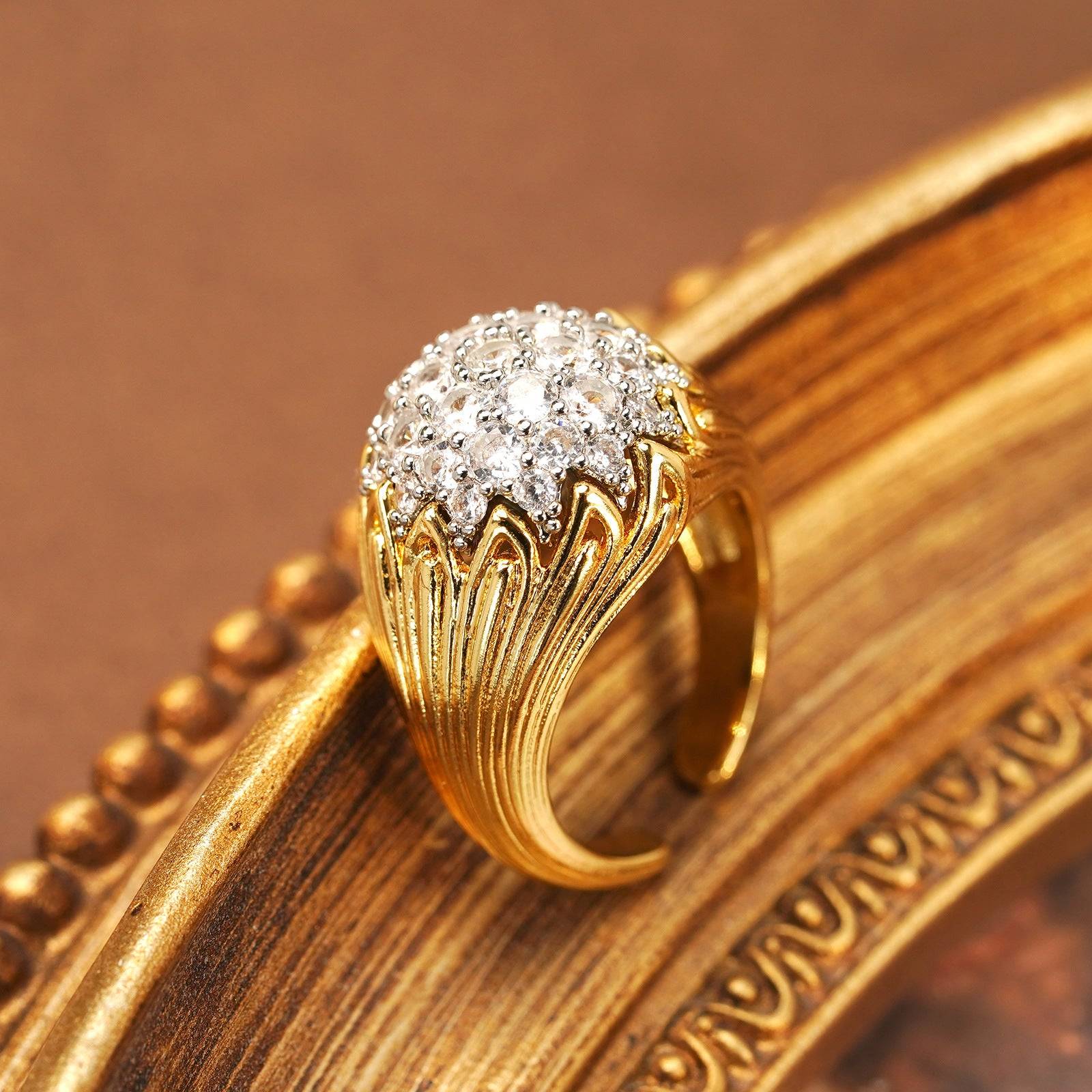 Ever P. vintage cluster ring featuring an 18K gold dome and sunburst pave design.