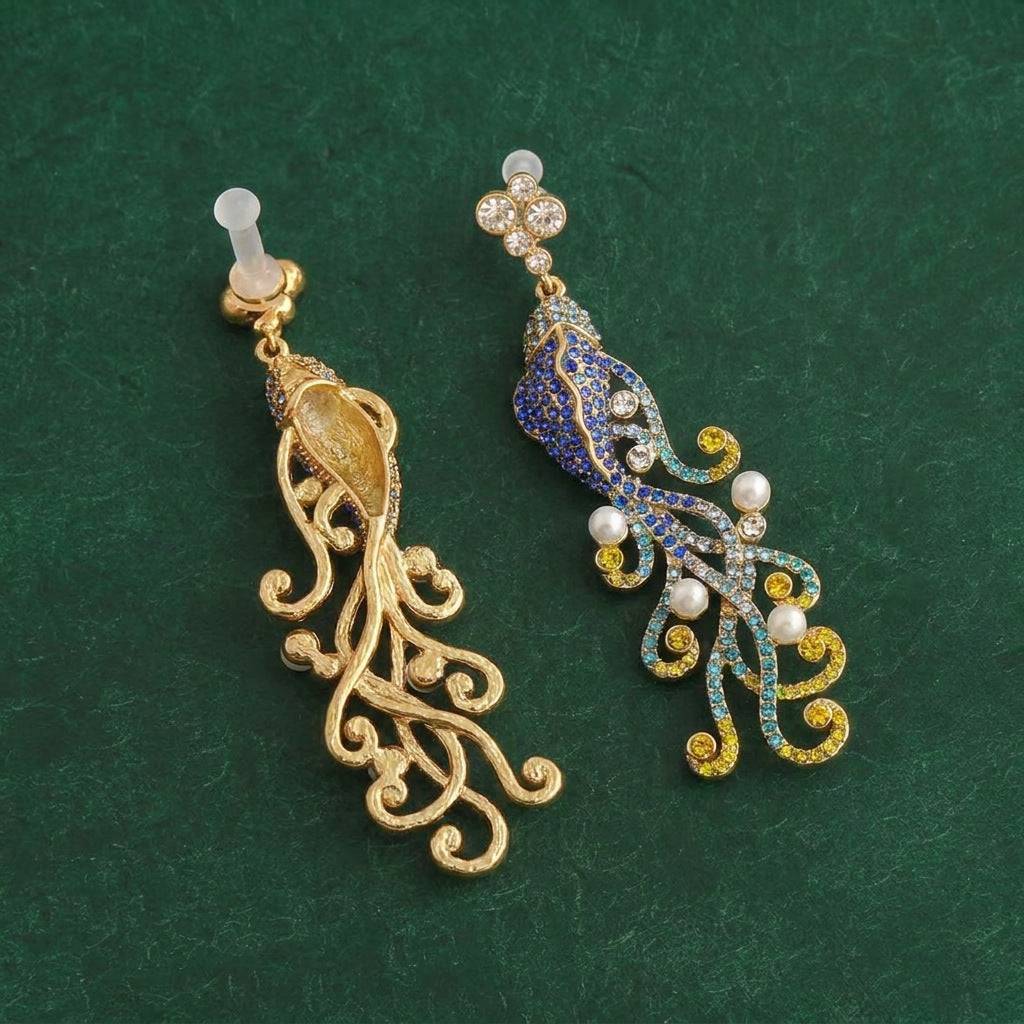 Side perspective of the 7.4cm long vintage drop earrings showing the articulated fish body.