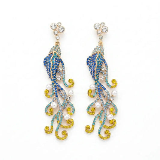Ever P. vintage fish earrings featuring an oversized statement design with blue and yellow crystals.
